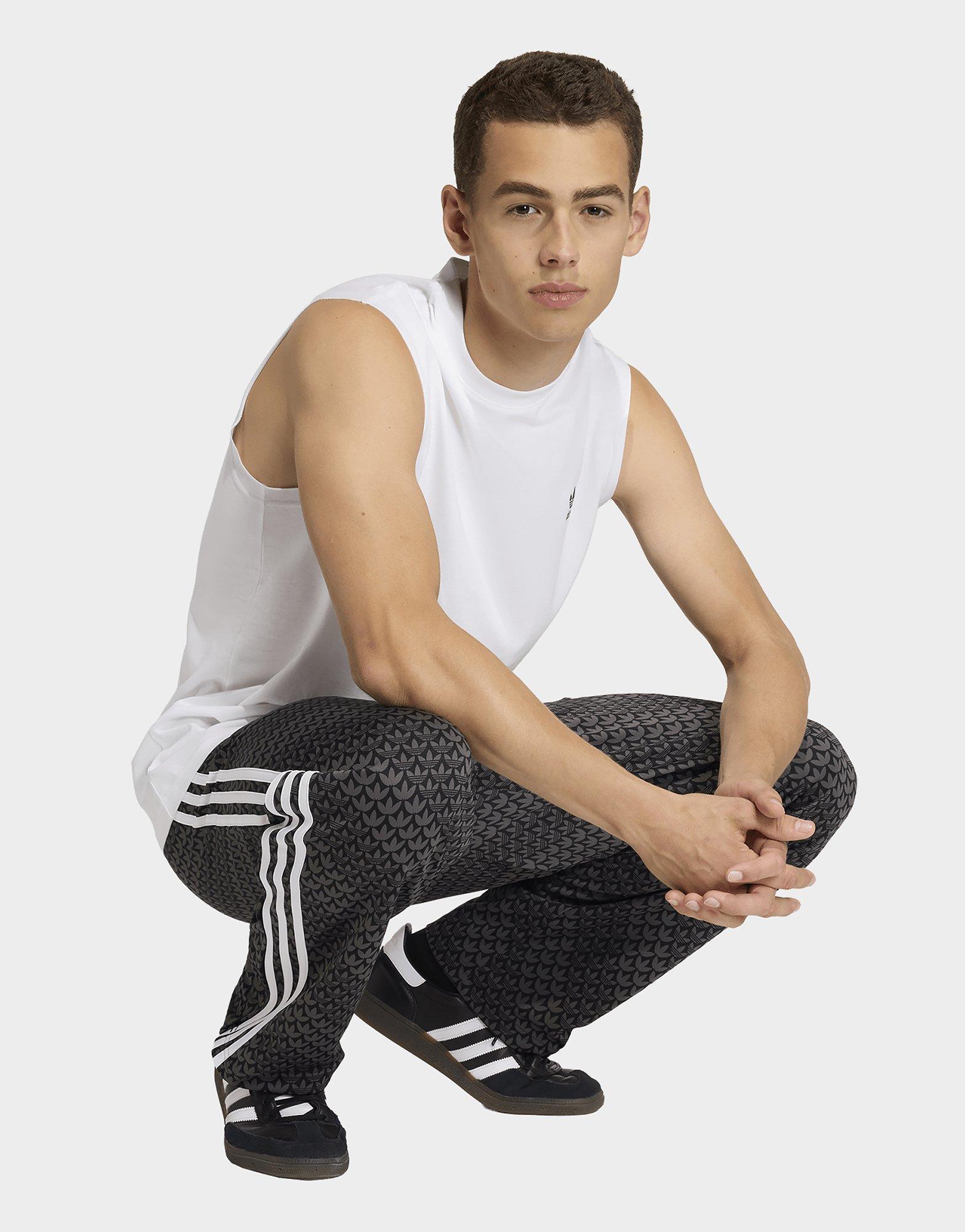 adidas PANTALÓN DE CHÁNDAL FIREBIRD LOOSE MONOGRAM