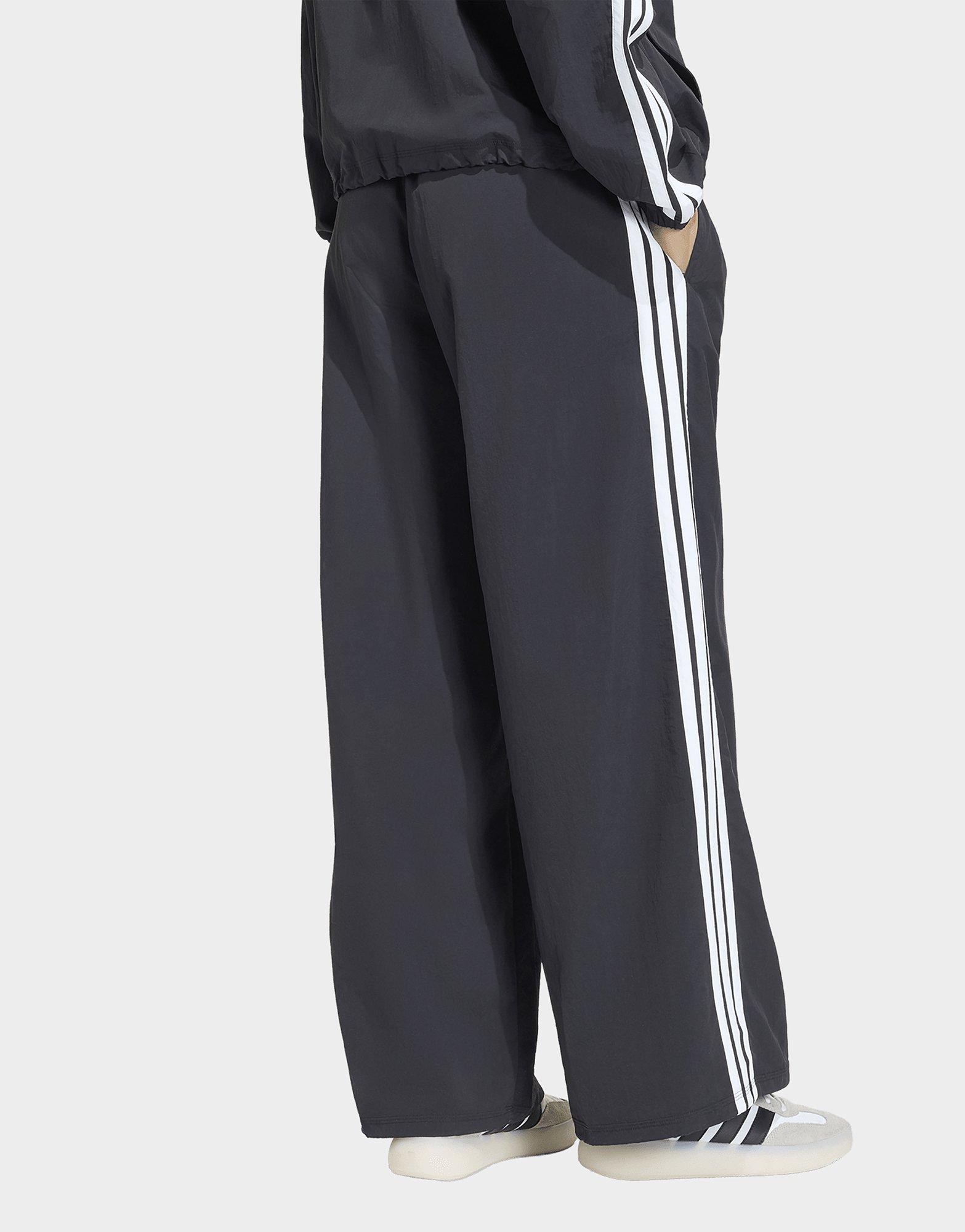 adidas Pantalon de survêtement avec élastiques jambes larges toile Iconic