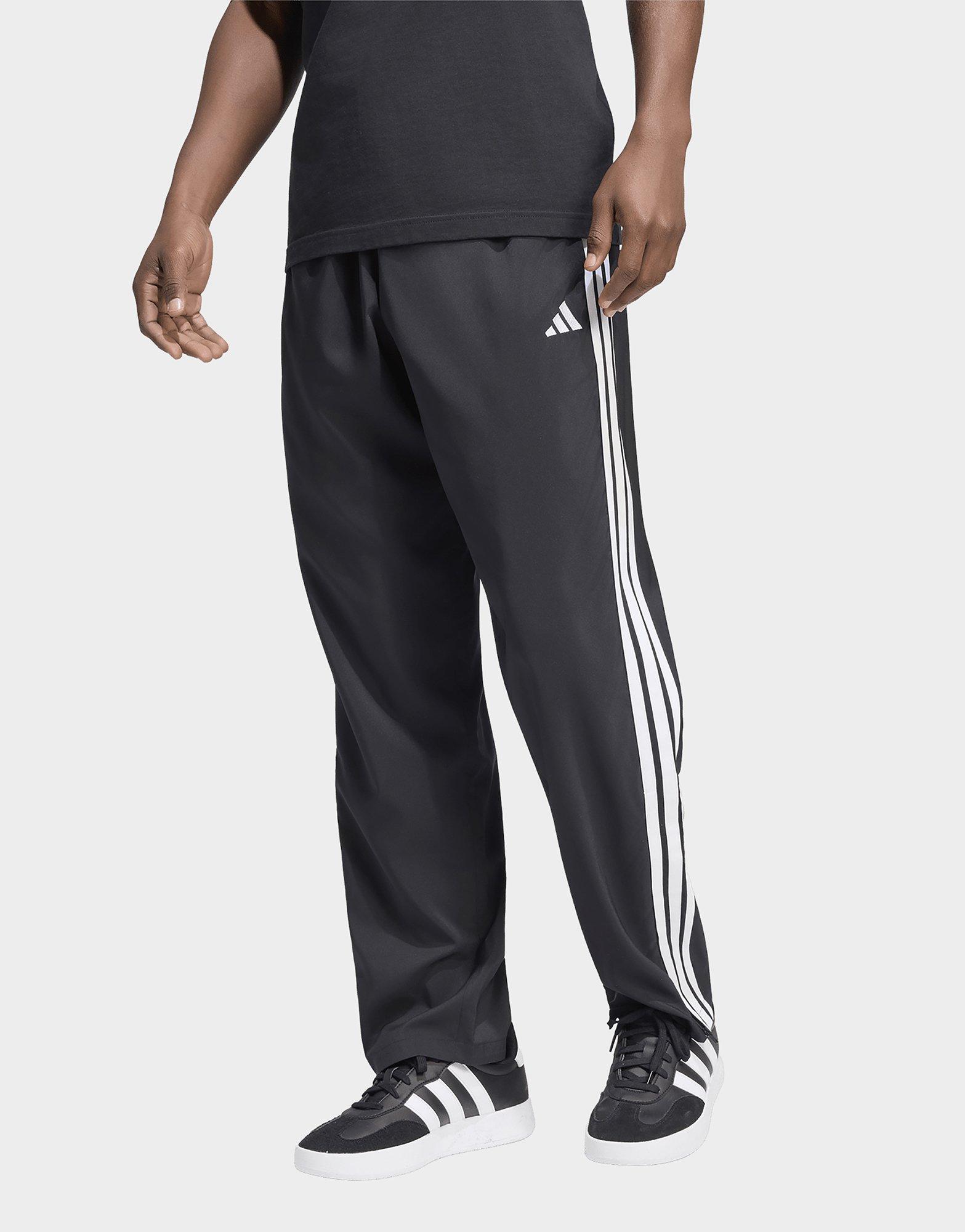 adidas Pantaloni Essentials 3-Stripes Stanford Lite Woven Tapered con orlo aperto