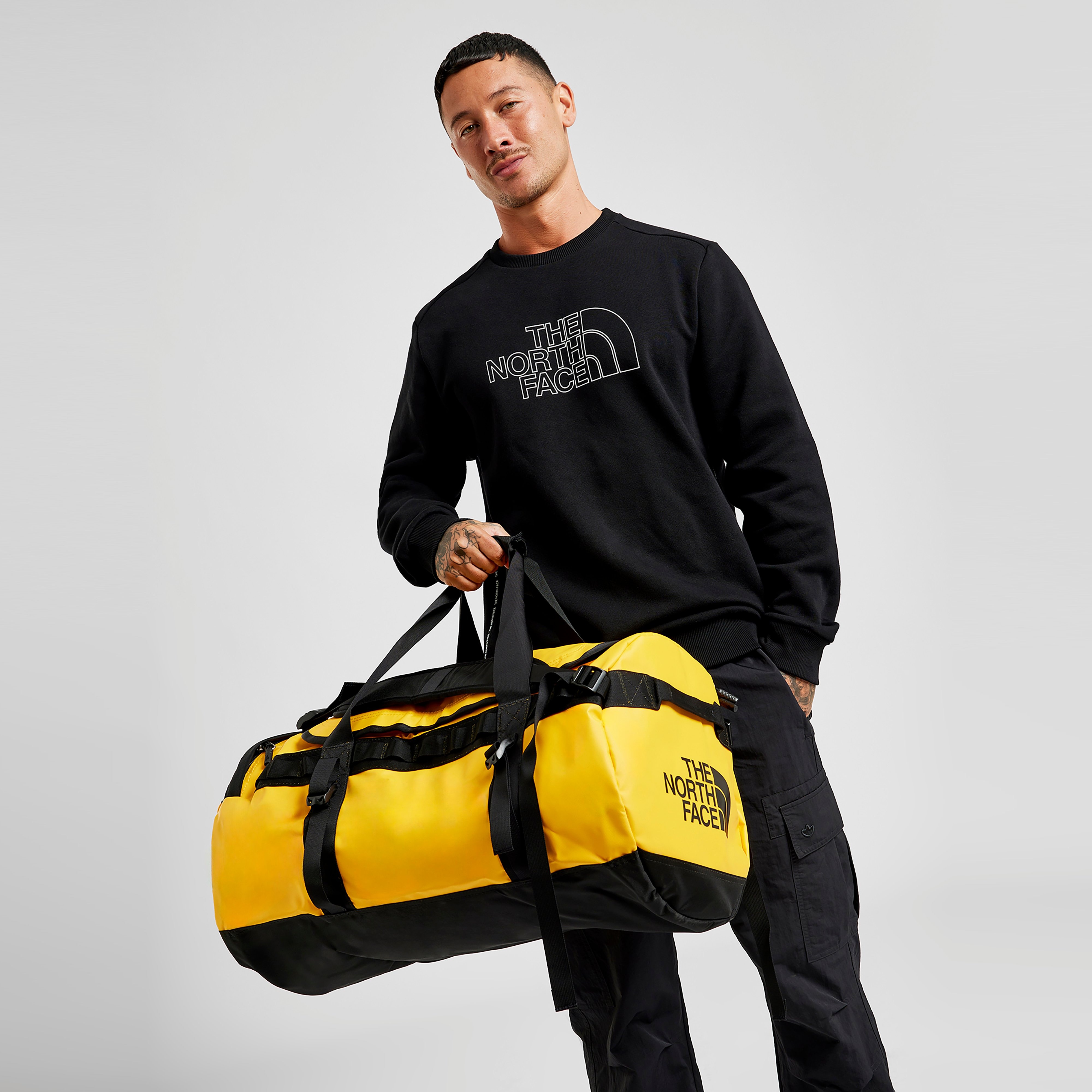 North face yellow duffel bag hotsell