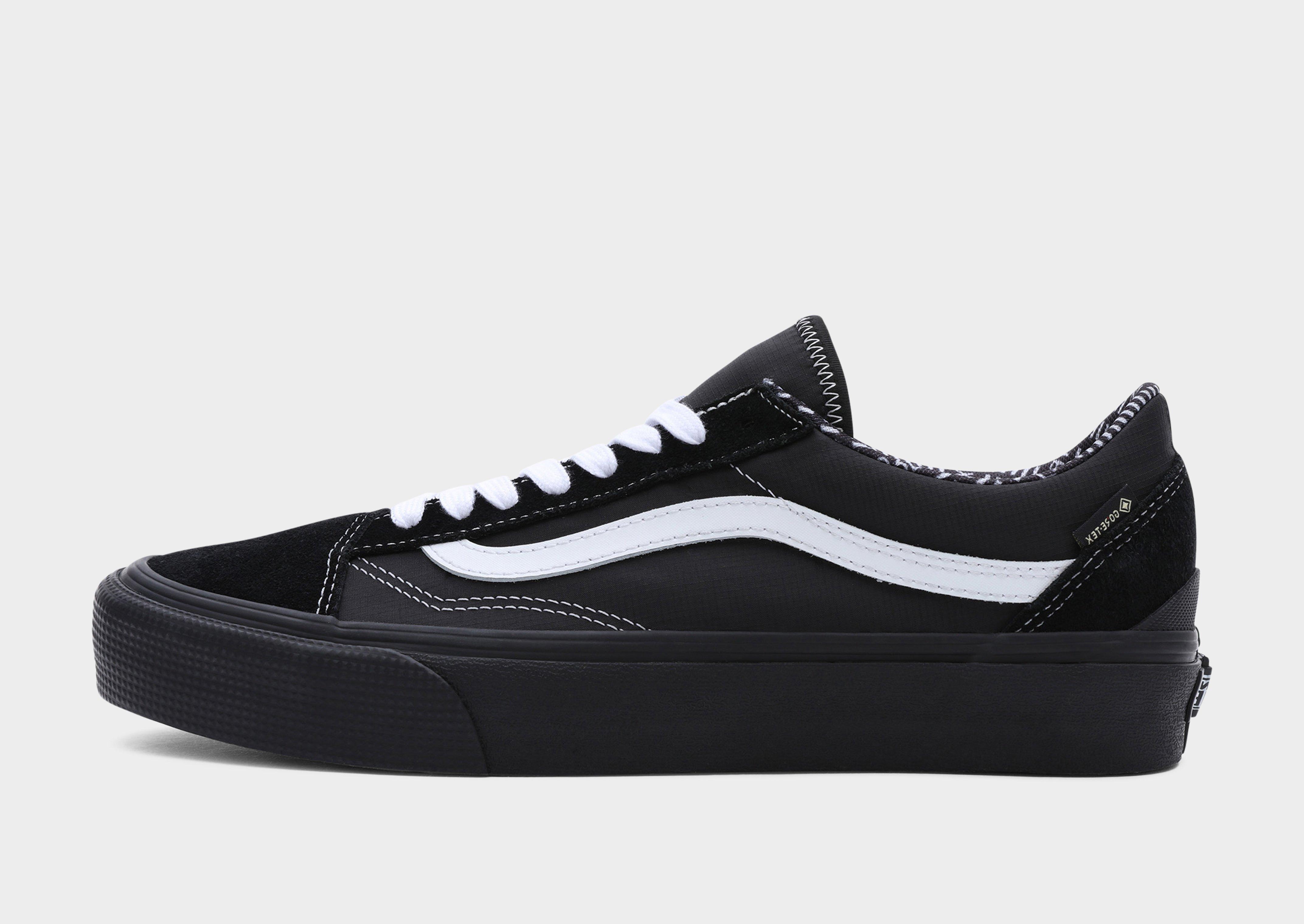 Vans all black store with white stripe