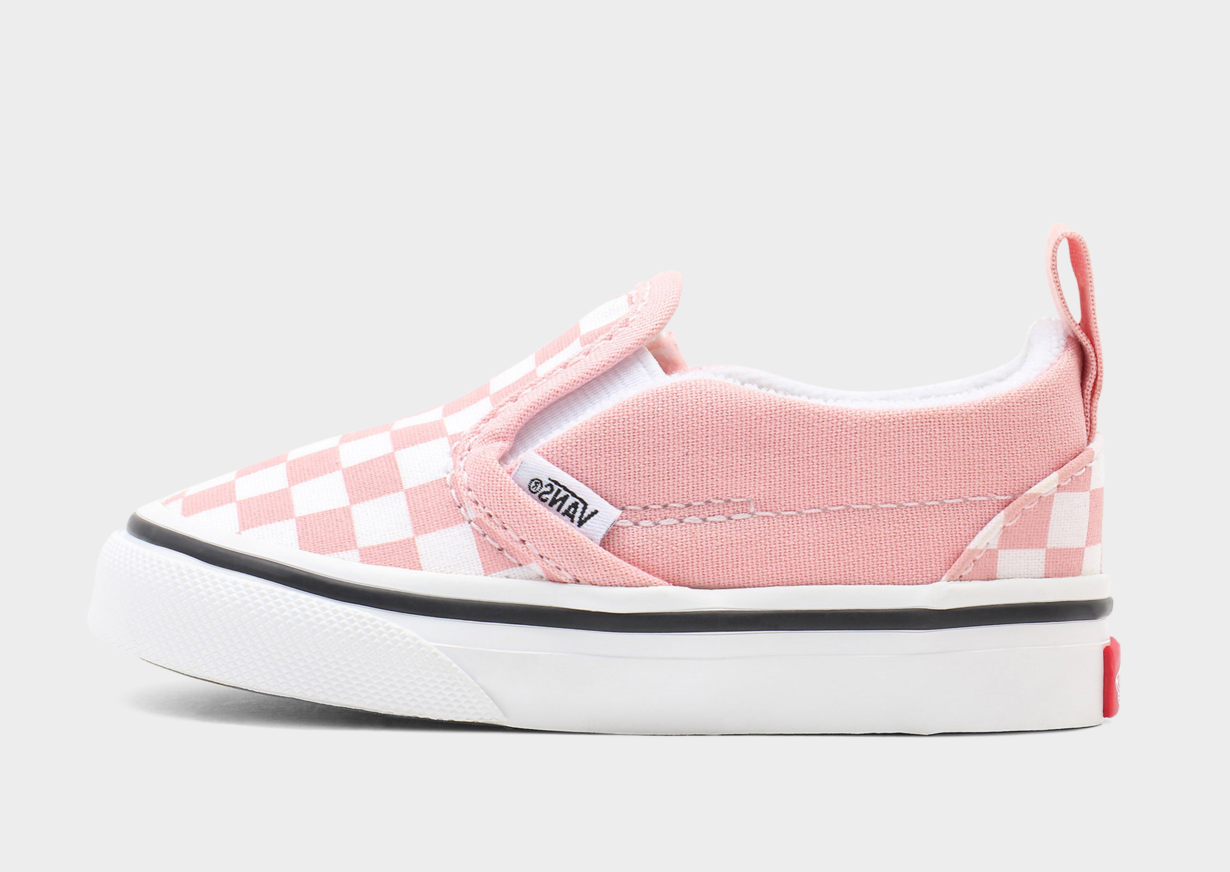 Pink and store white checker vans