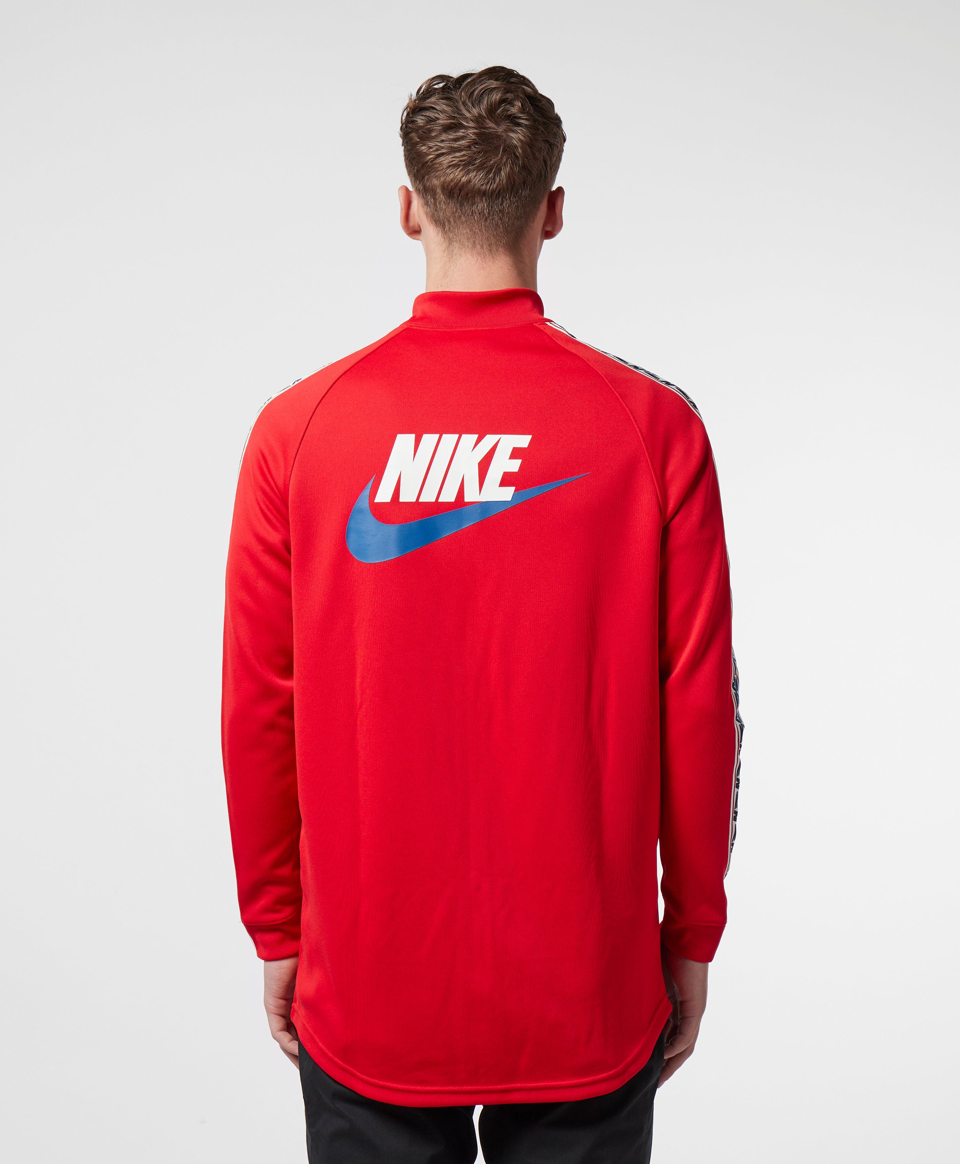 nike arch taped track top