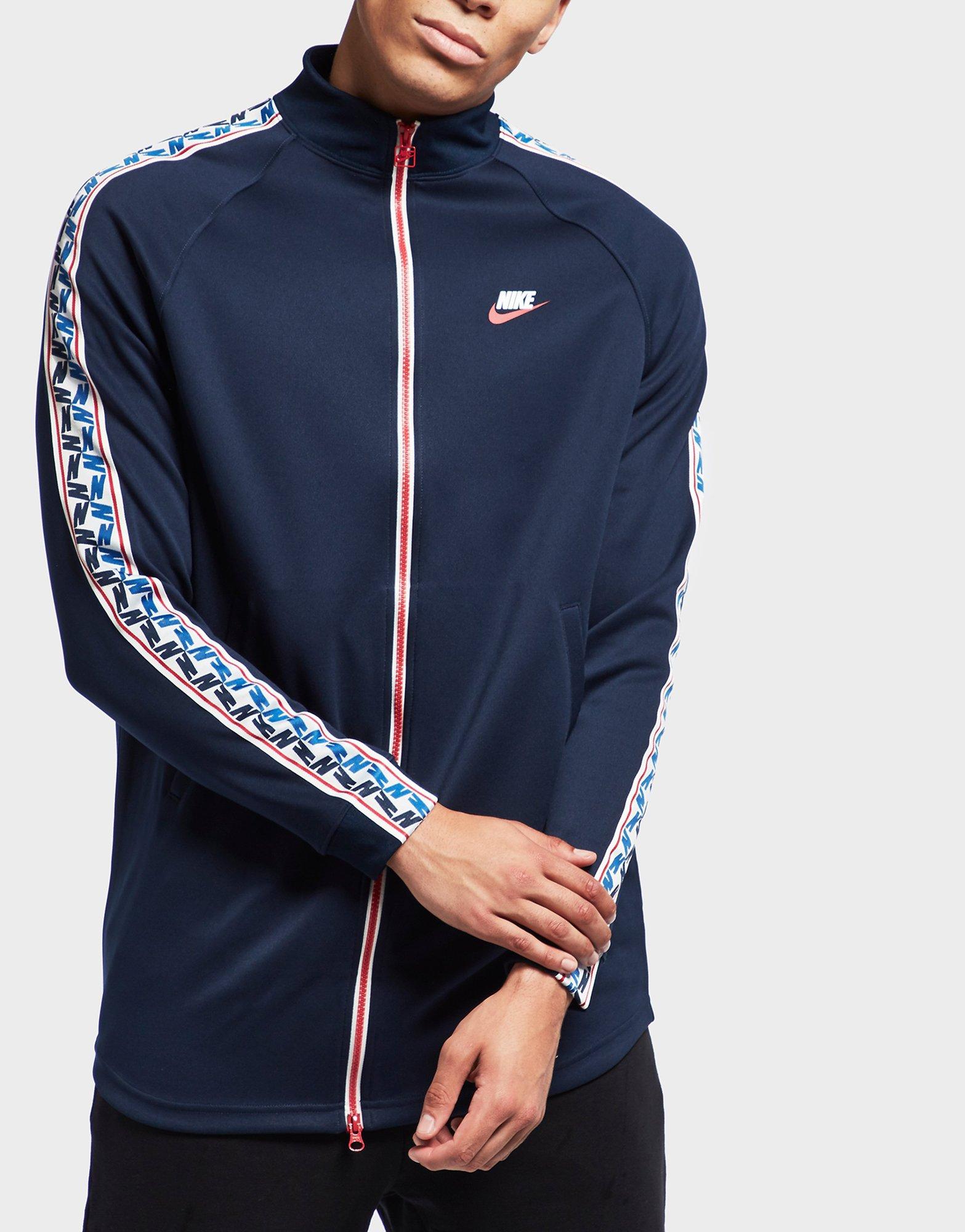 nike arch taped track top