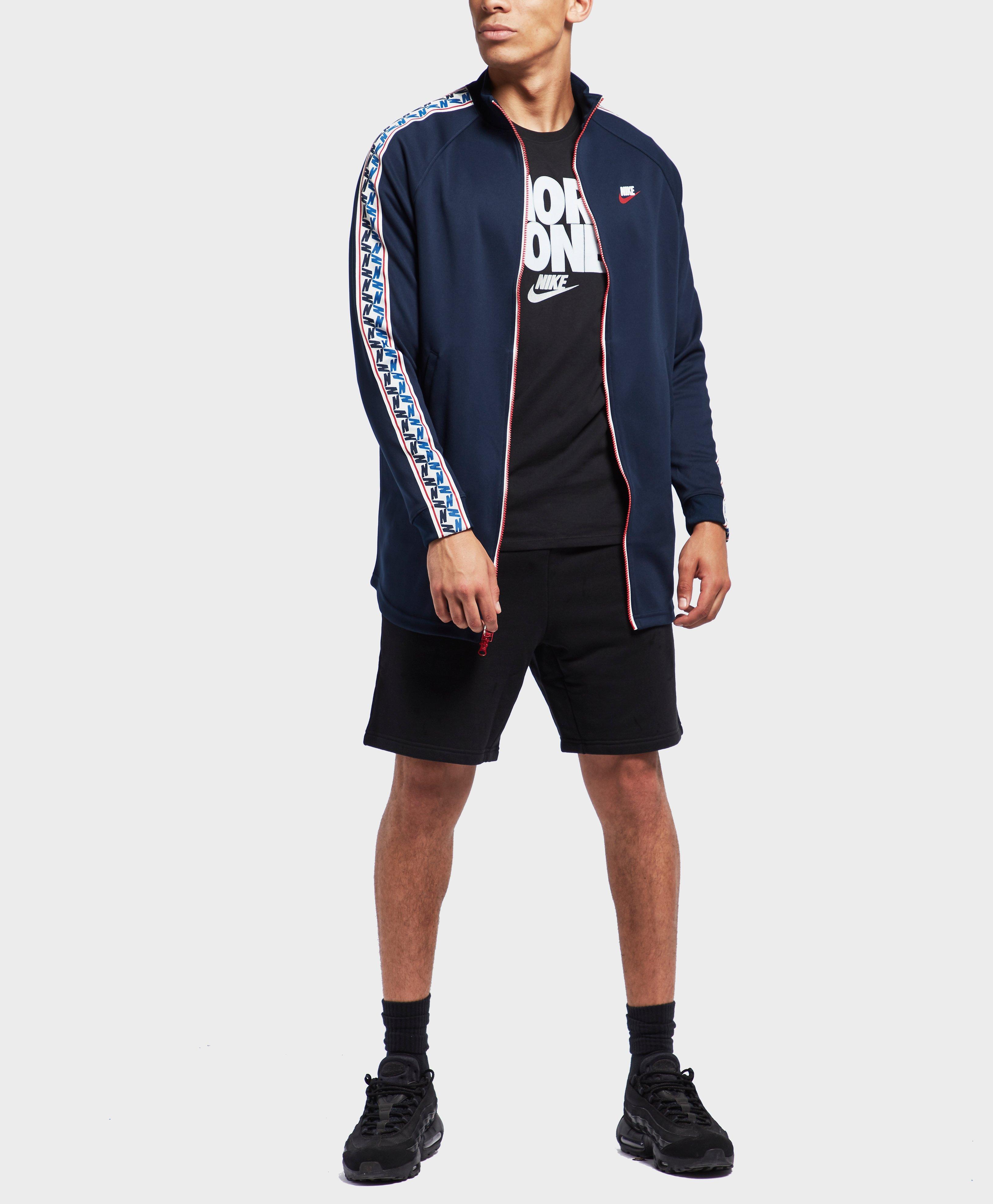 nike arch taped track top