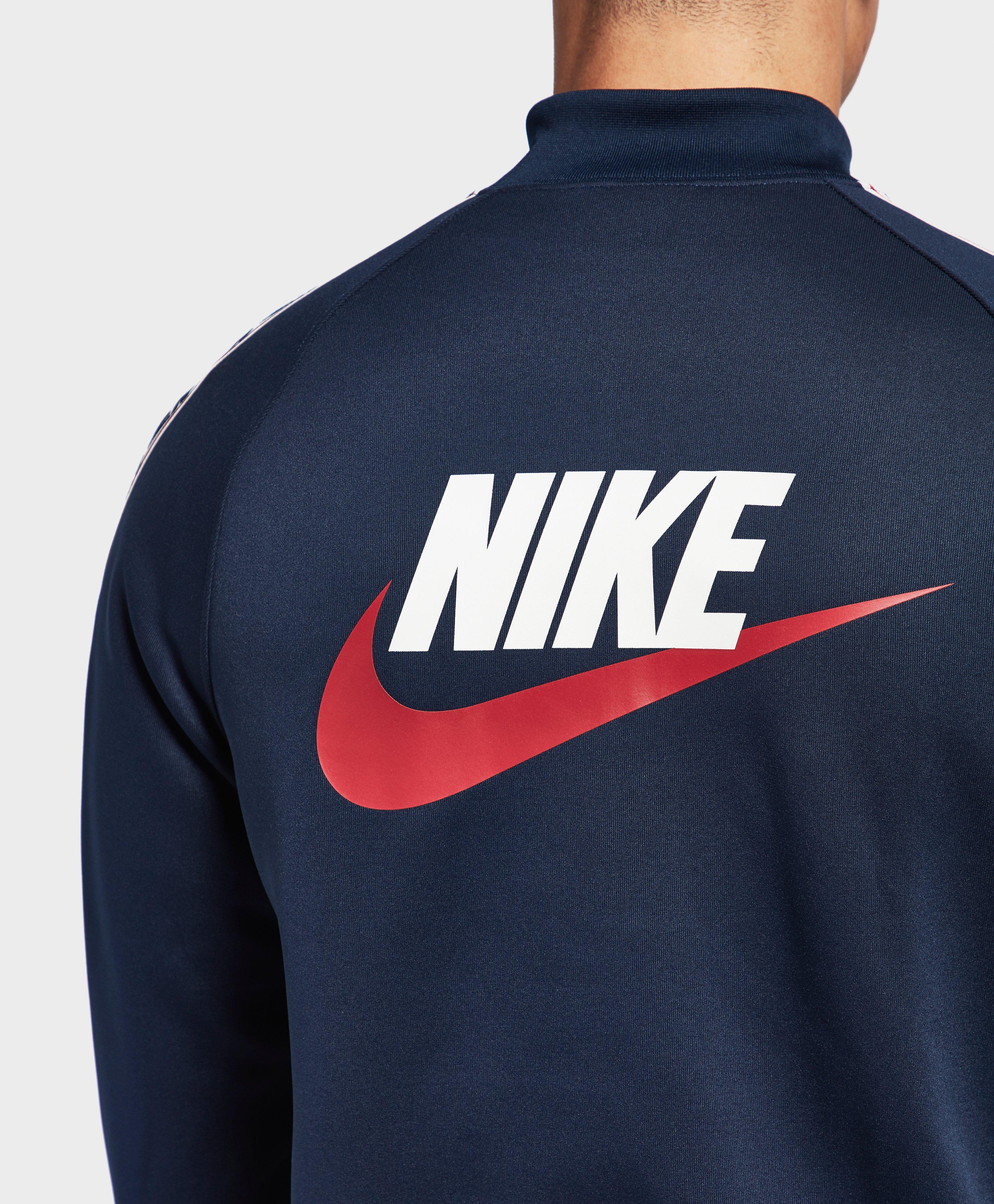 nike arch taped track top