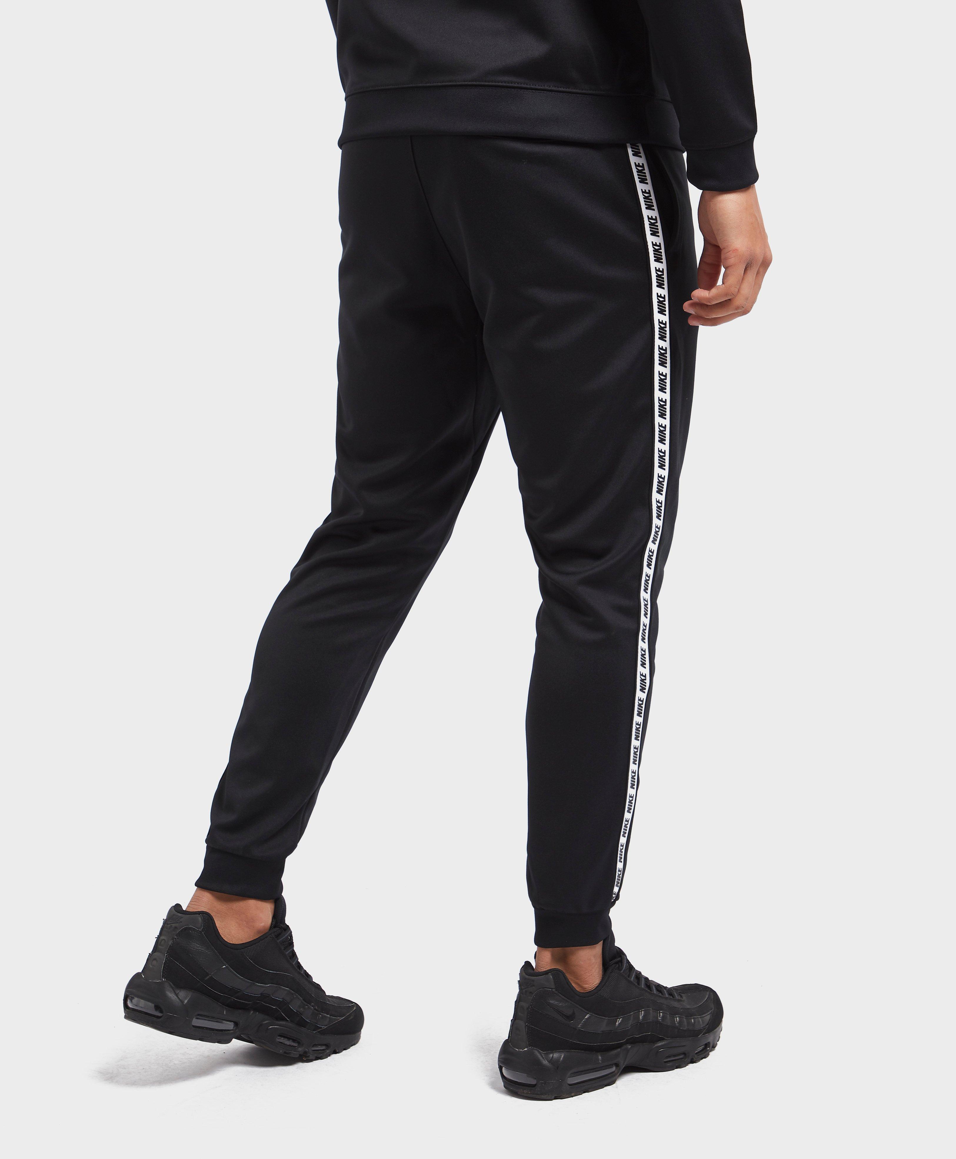 nike tape cuffed track pants