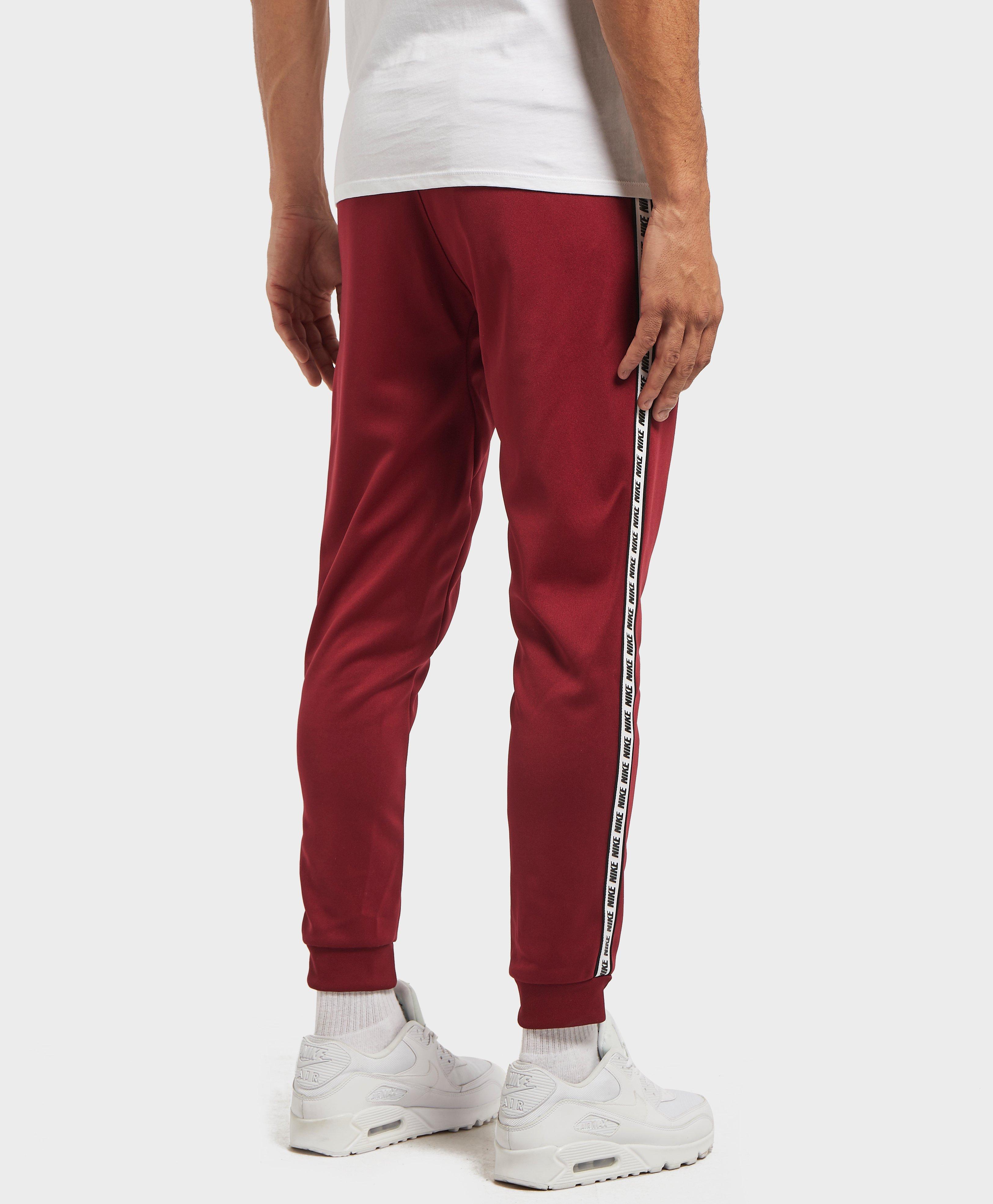 nike taped cuffed track pants