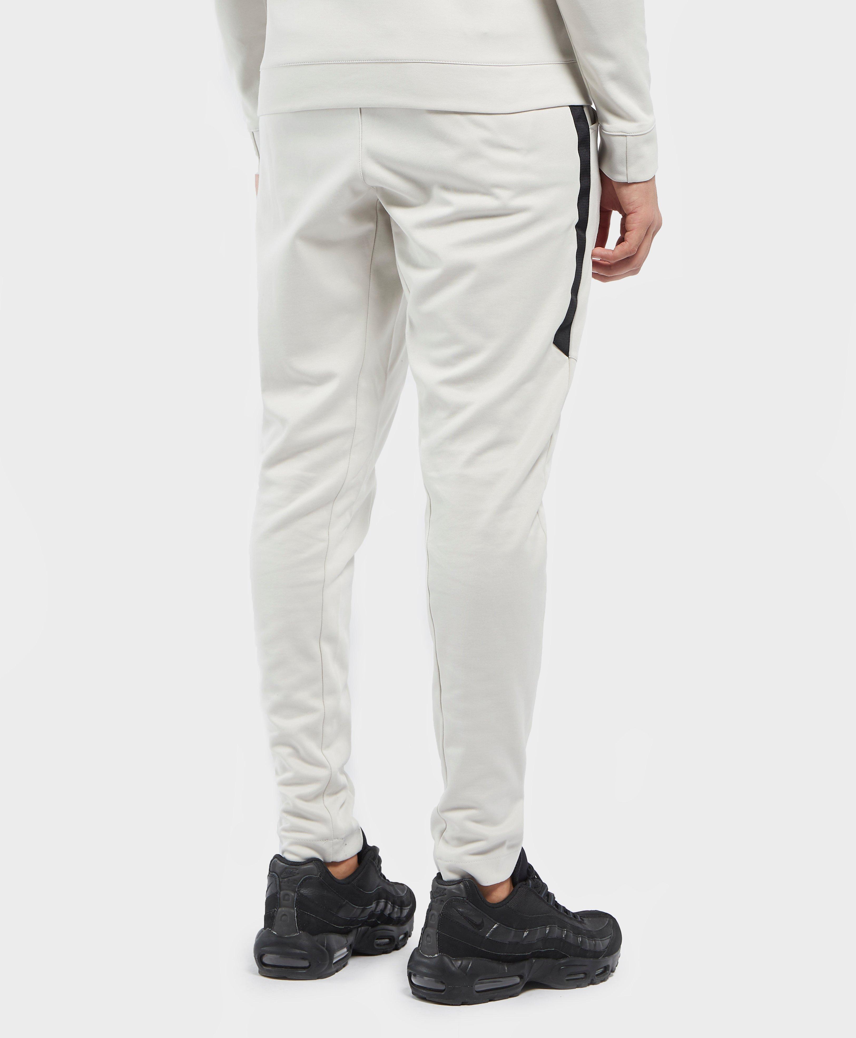 nike tribute track pants white