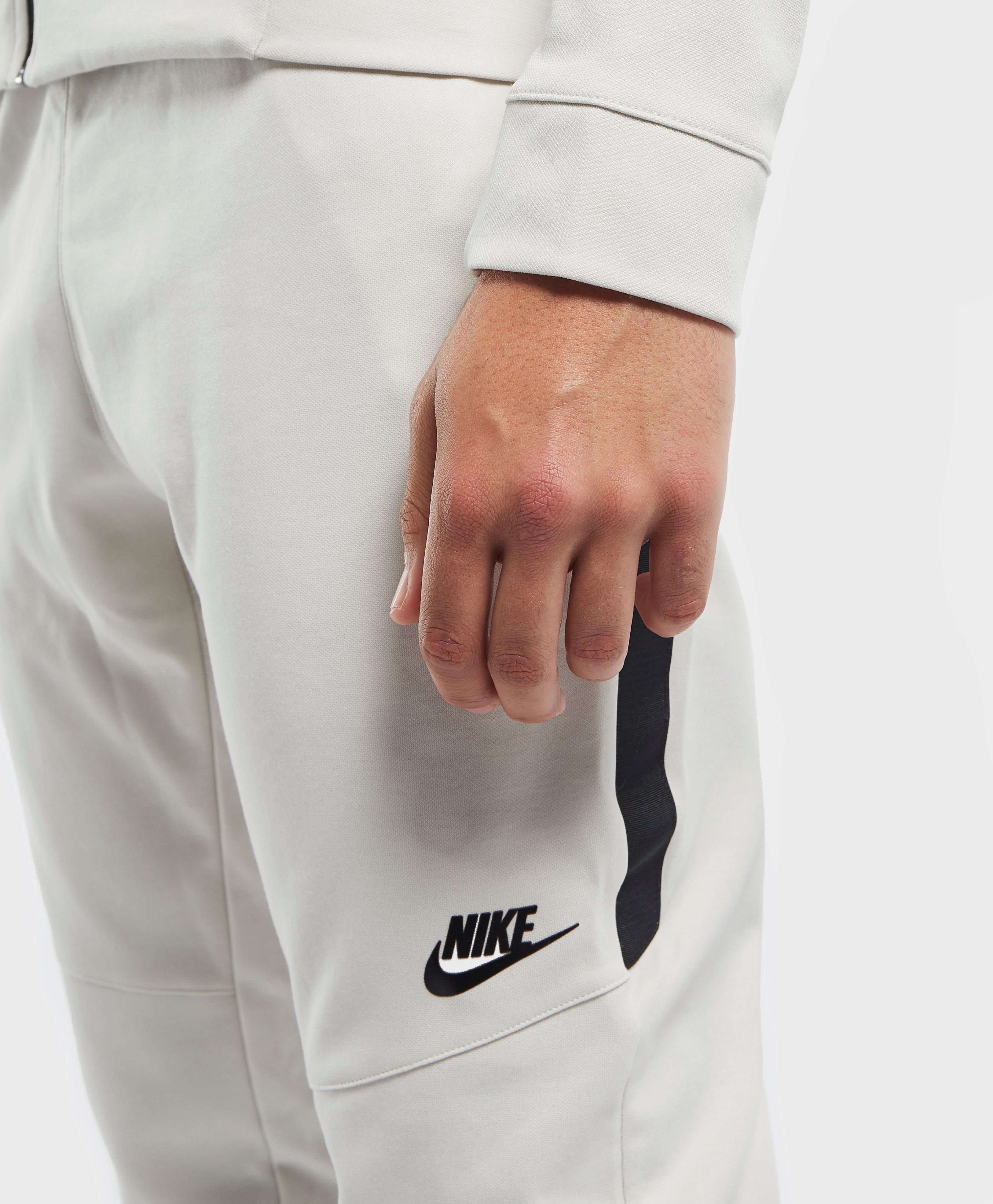 nike tribute track pant light bone