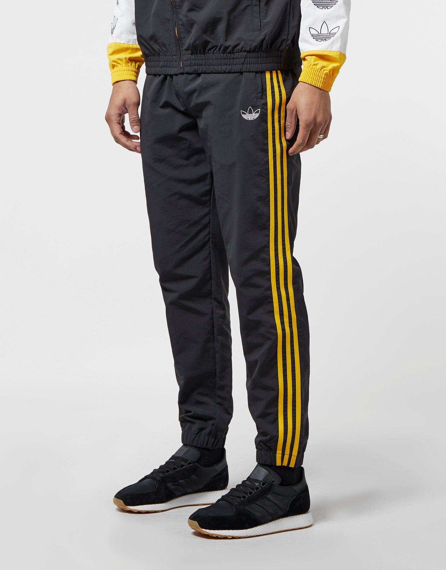 yellow striped adidas pants