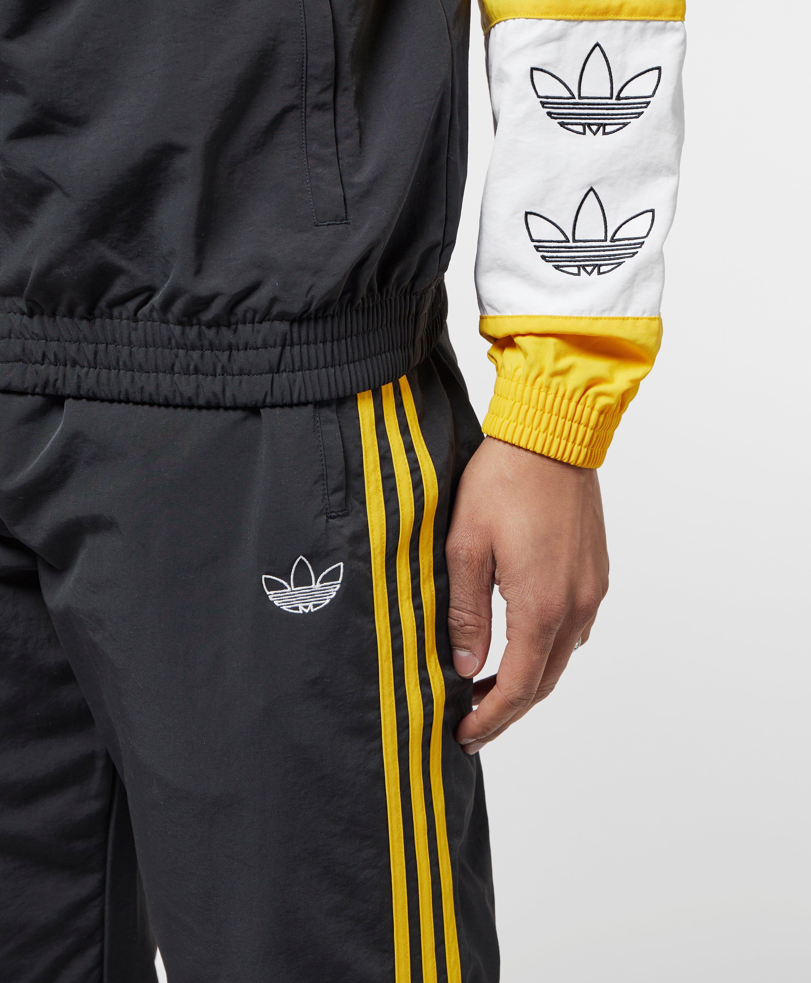 adidas track pants yellow stripe