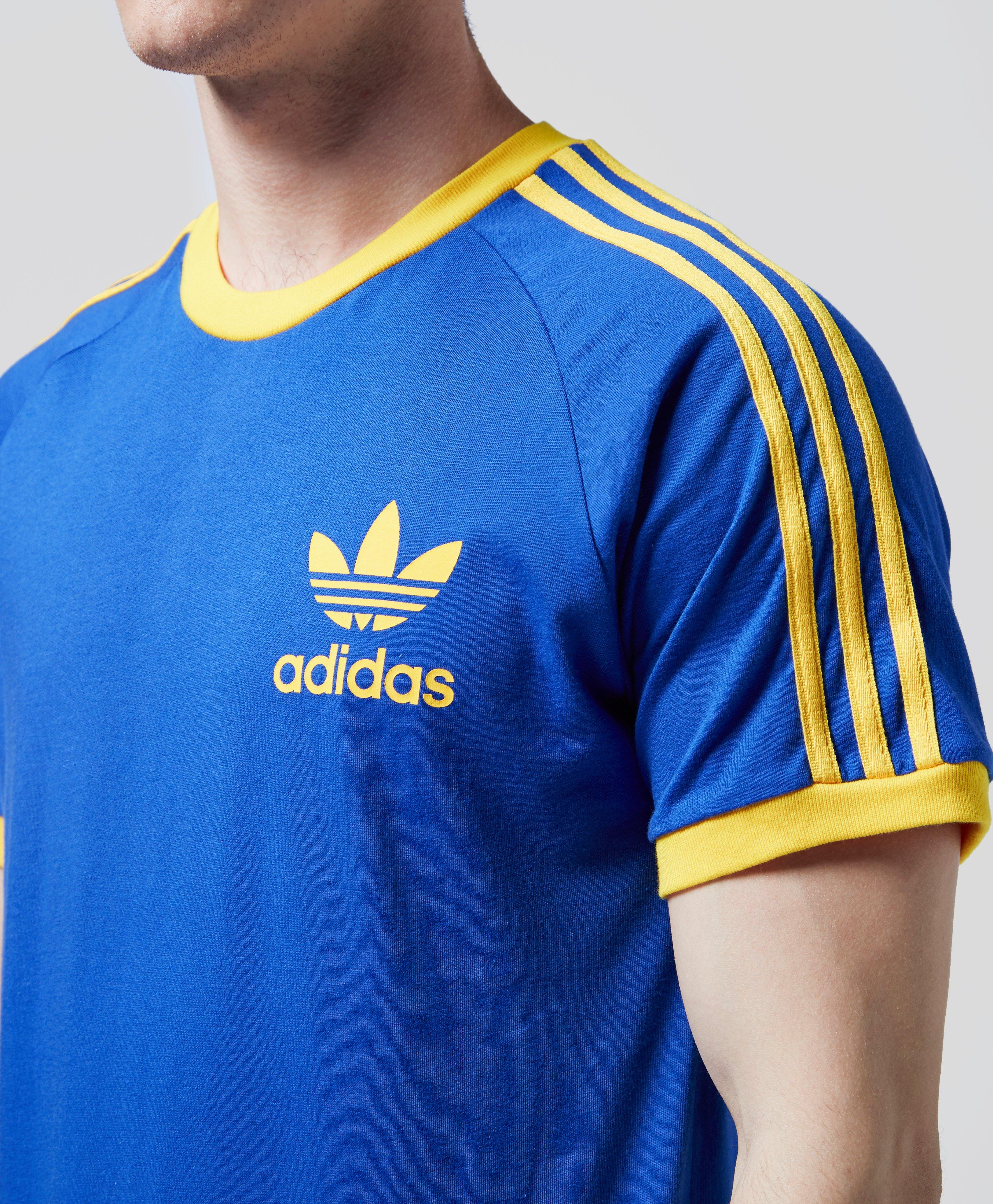 blue and yellow adidas shirt