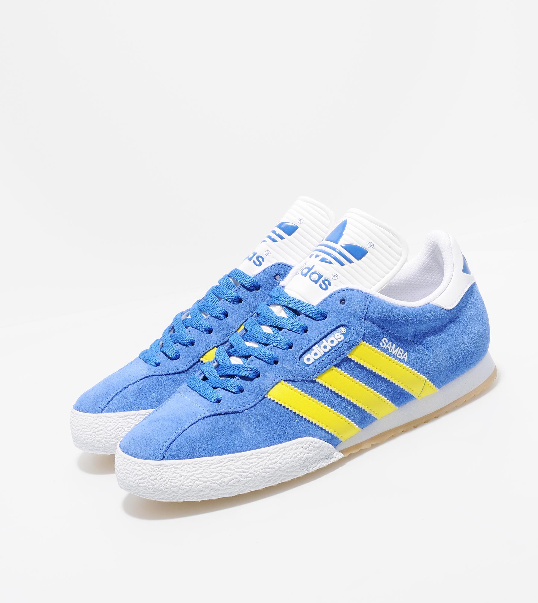 blue and yellow adidas samba trainers
