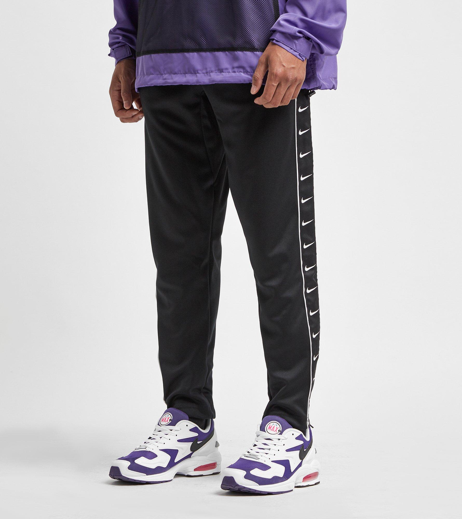 nike swoosh tape track pants