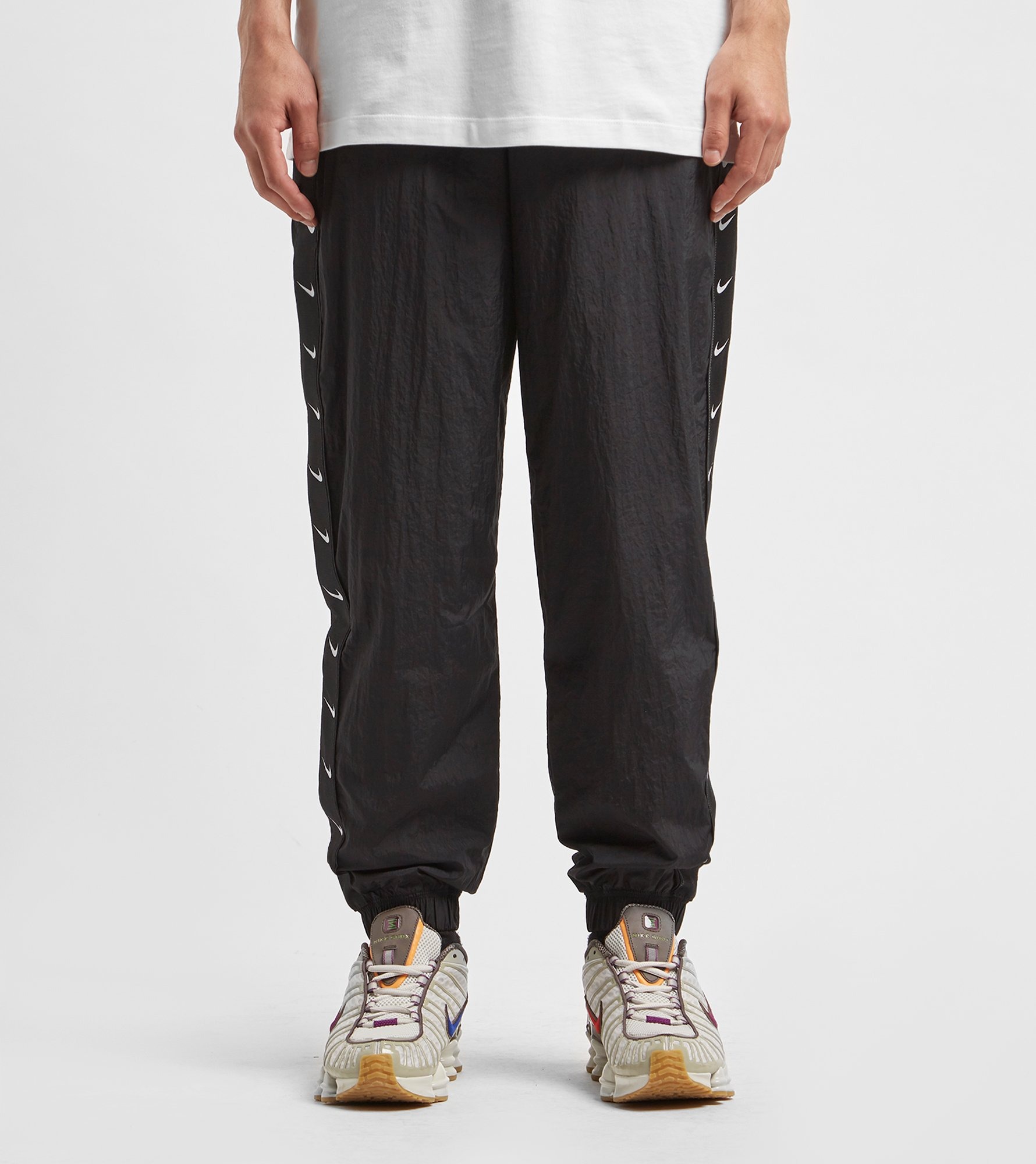 Nike vintage track pants. Nike Woven Swoosh track Pants. Nike Woven Swoosh Pant Black. Nike Woven track Running Pants. Штаны Nike all over Swoosh Pants.