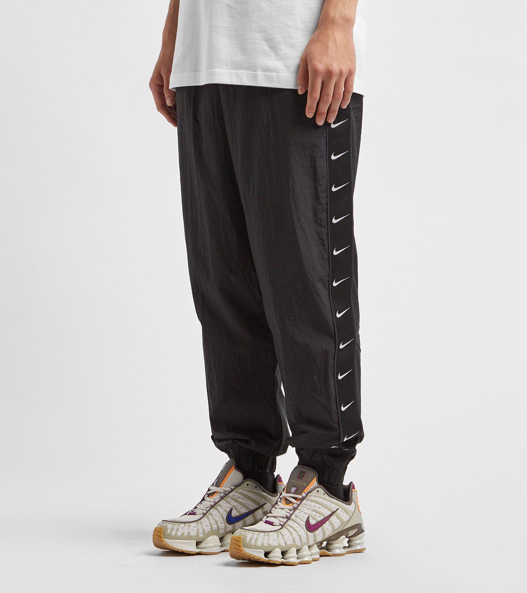 nike swoosh track pant