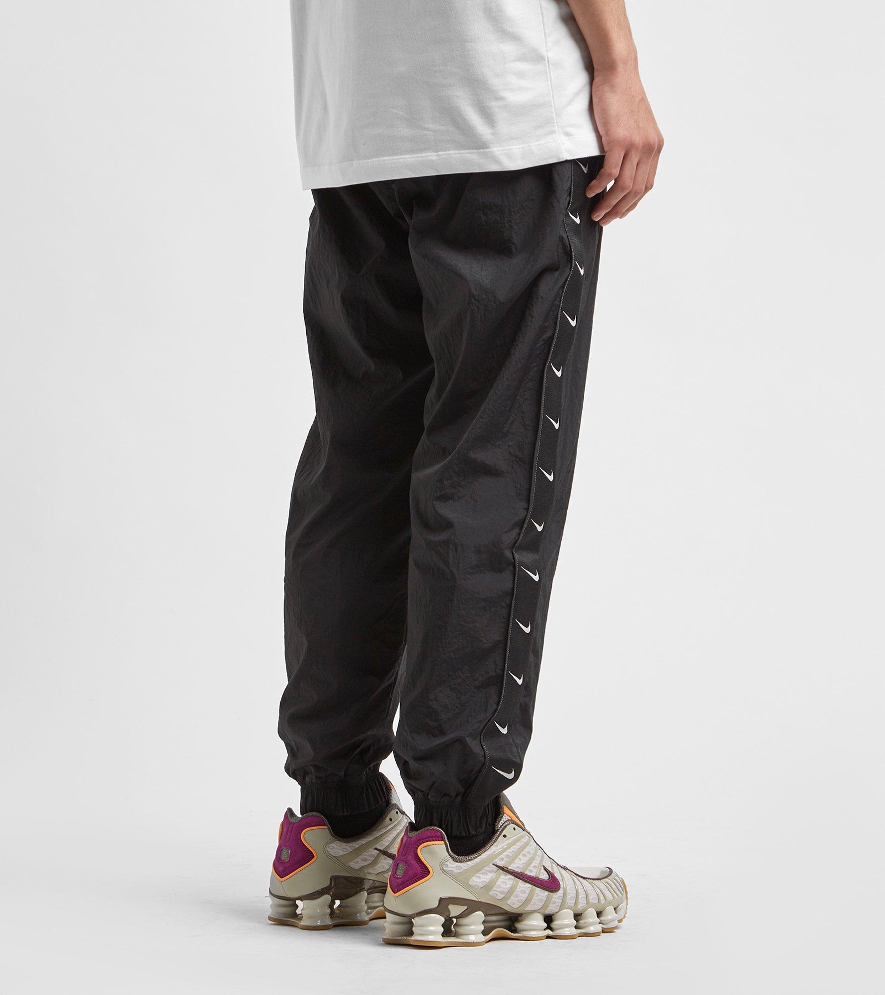 nike track pants swoosh