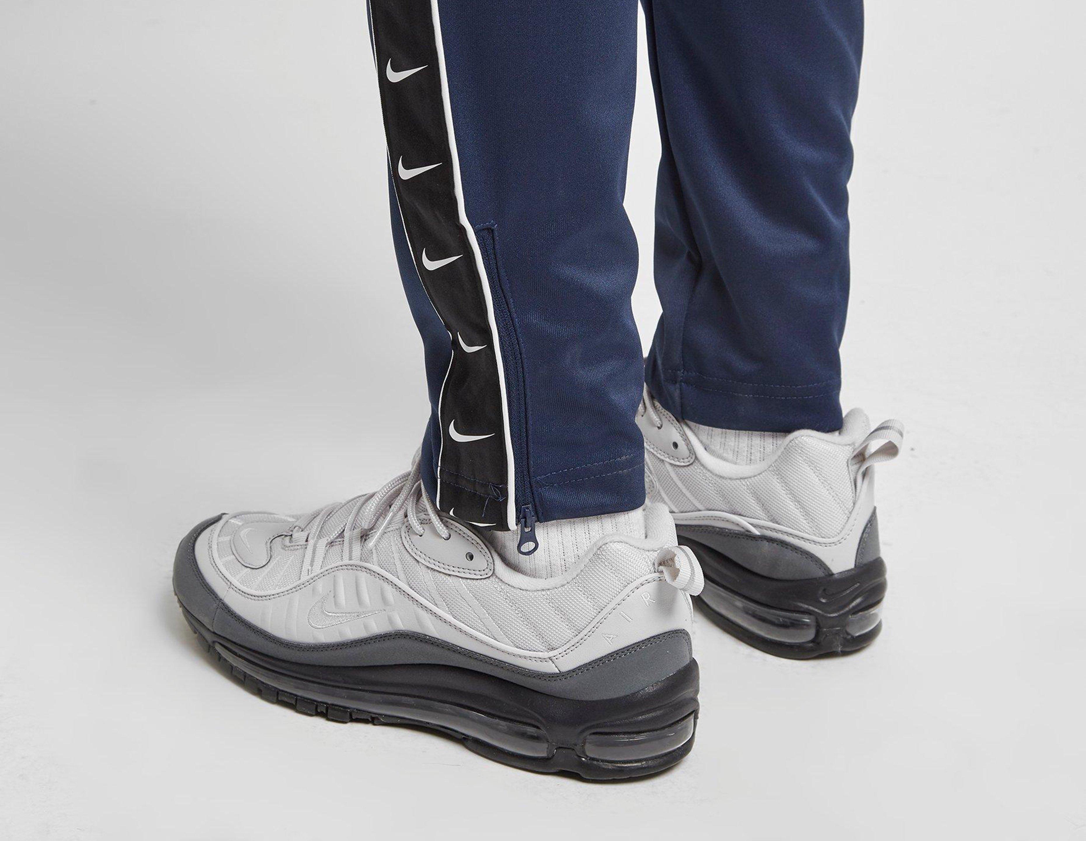 nike taped pants blue