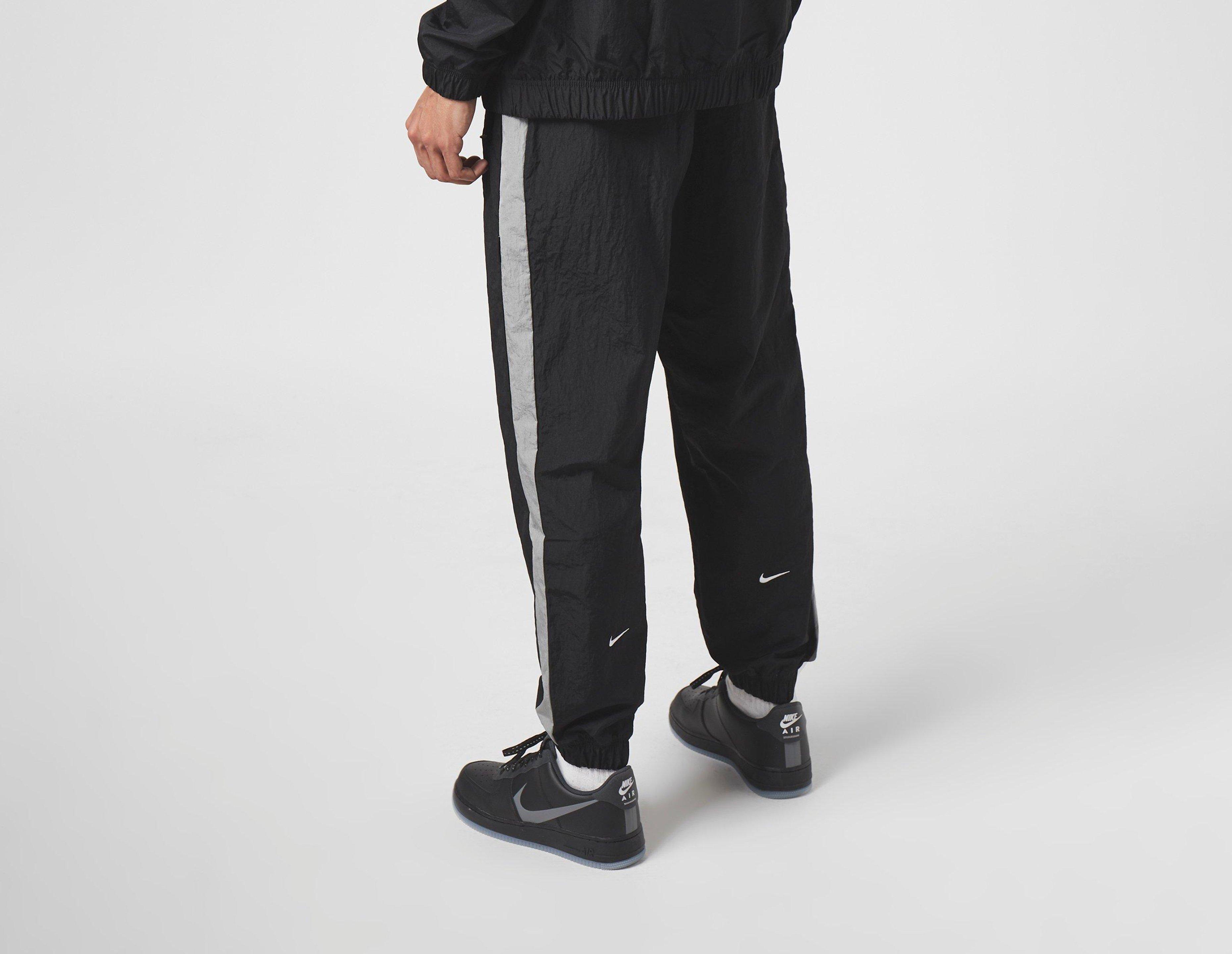 nike swoosh woven track pants