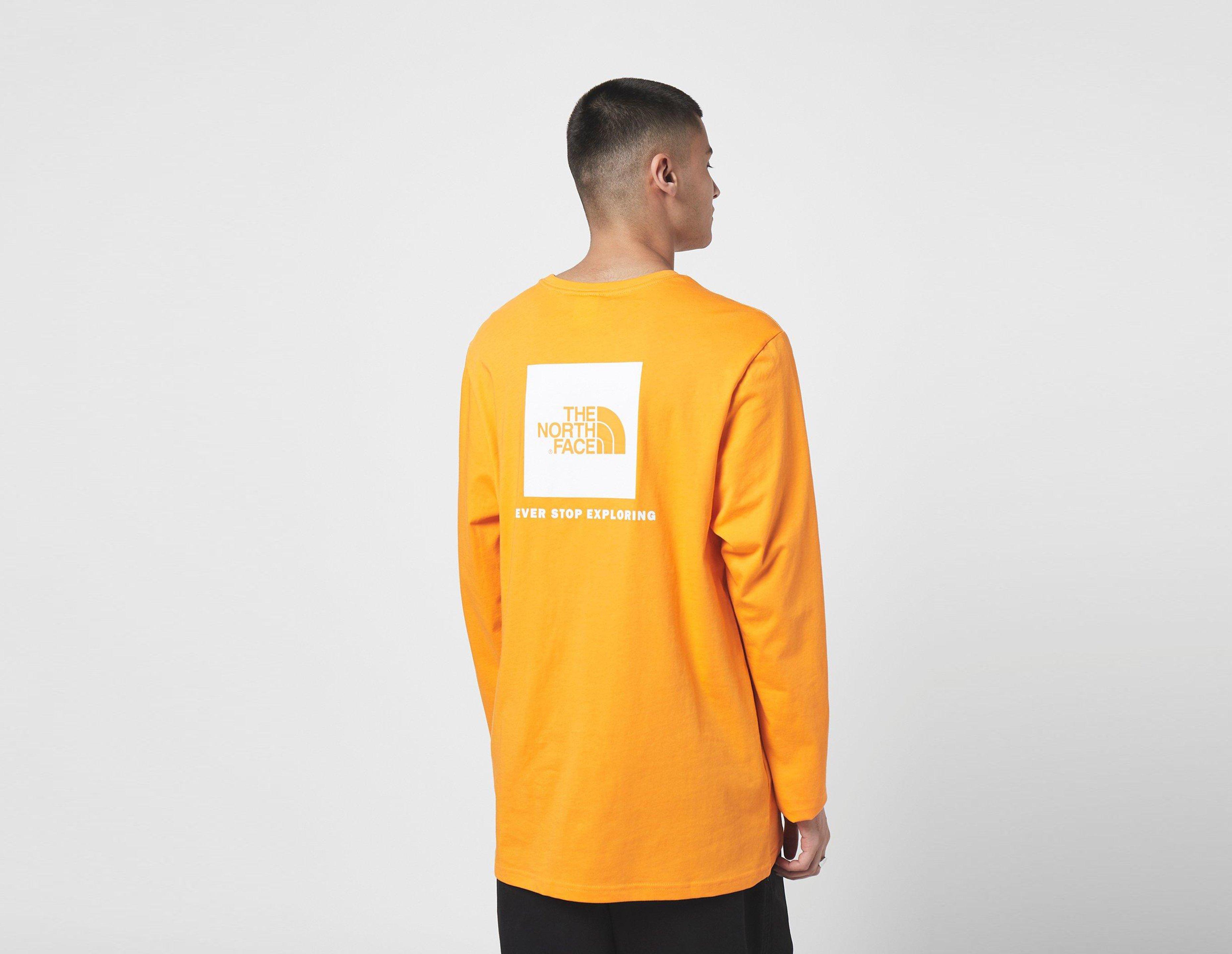 orange north face shirt