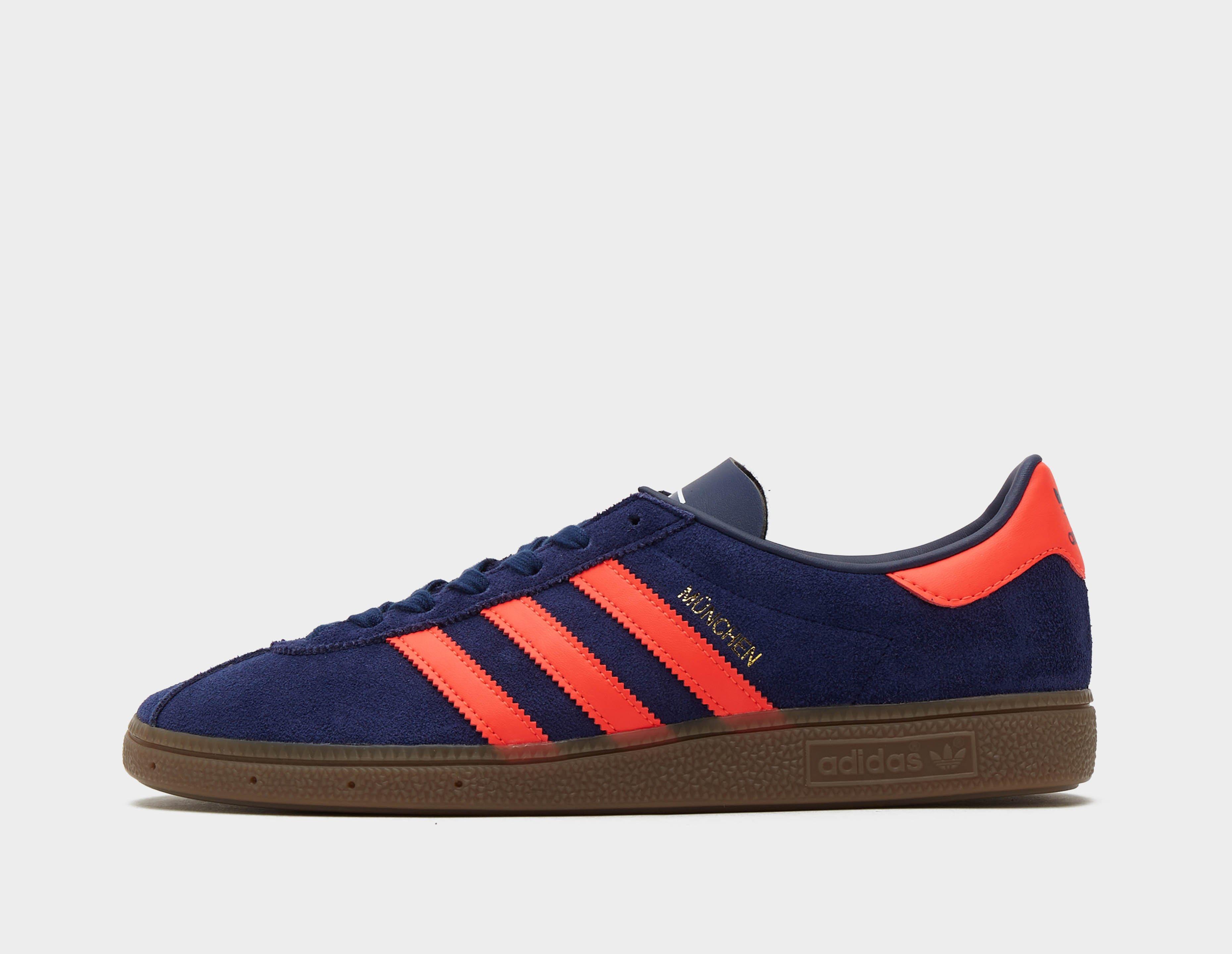 Navy blue and store orange adidas shoes