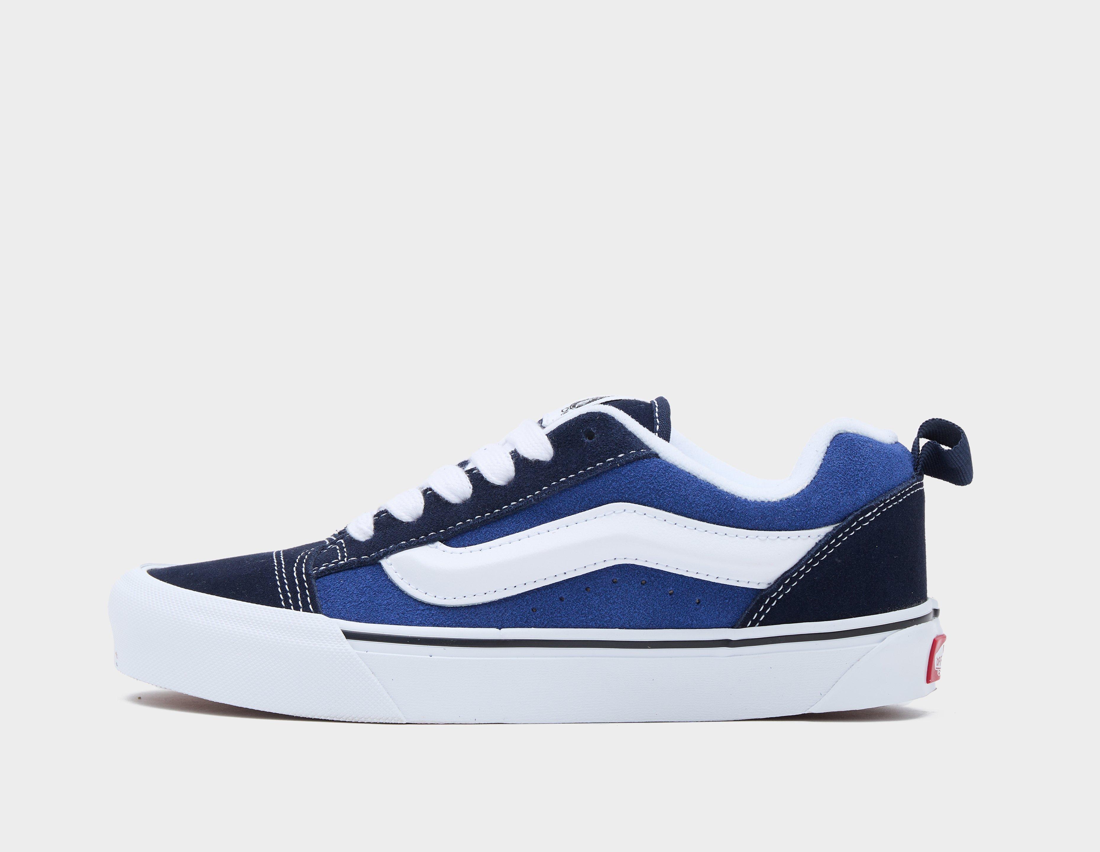 Dark blue and store white vans