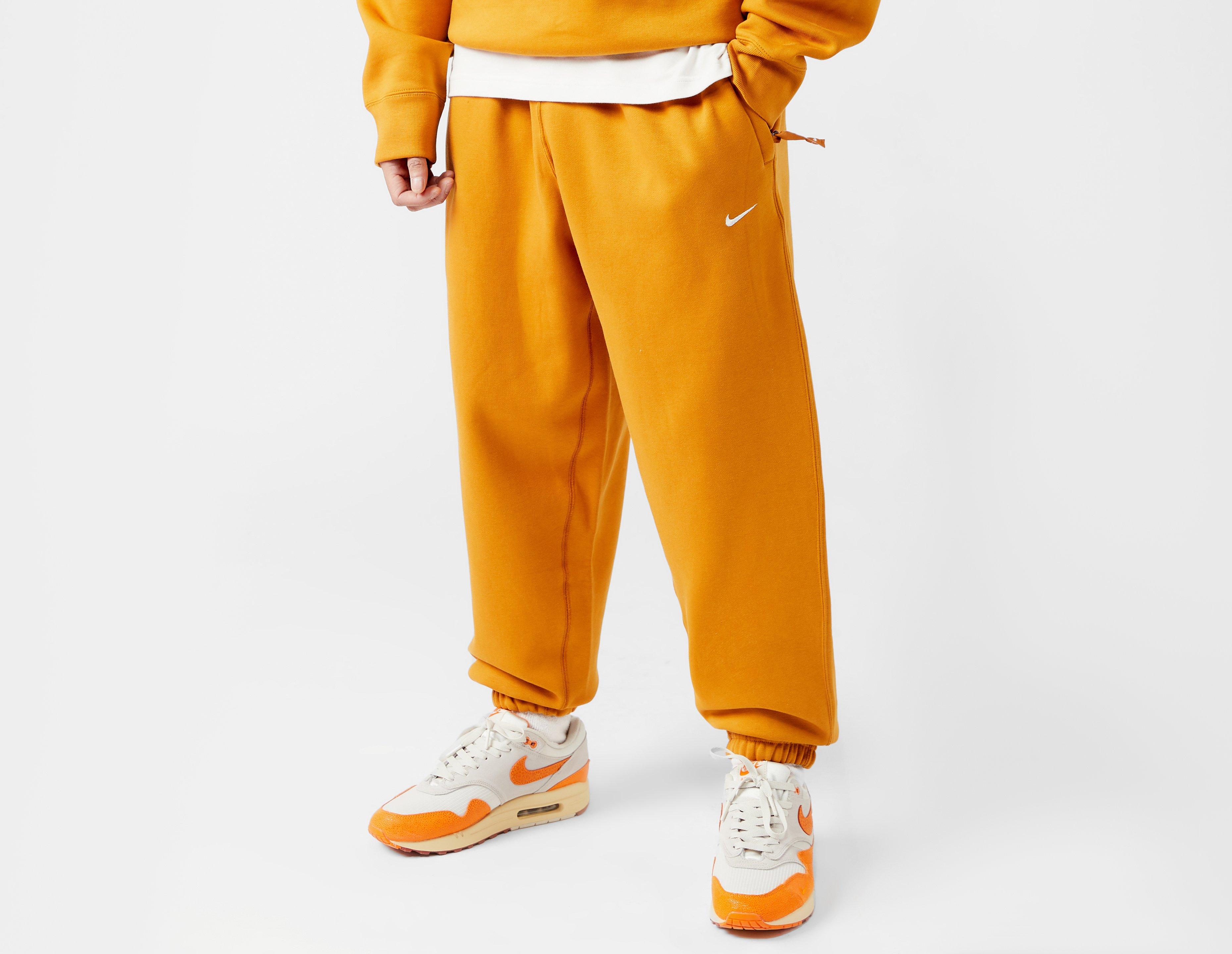 Orange nike sweatpants on sale