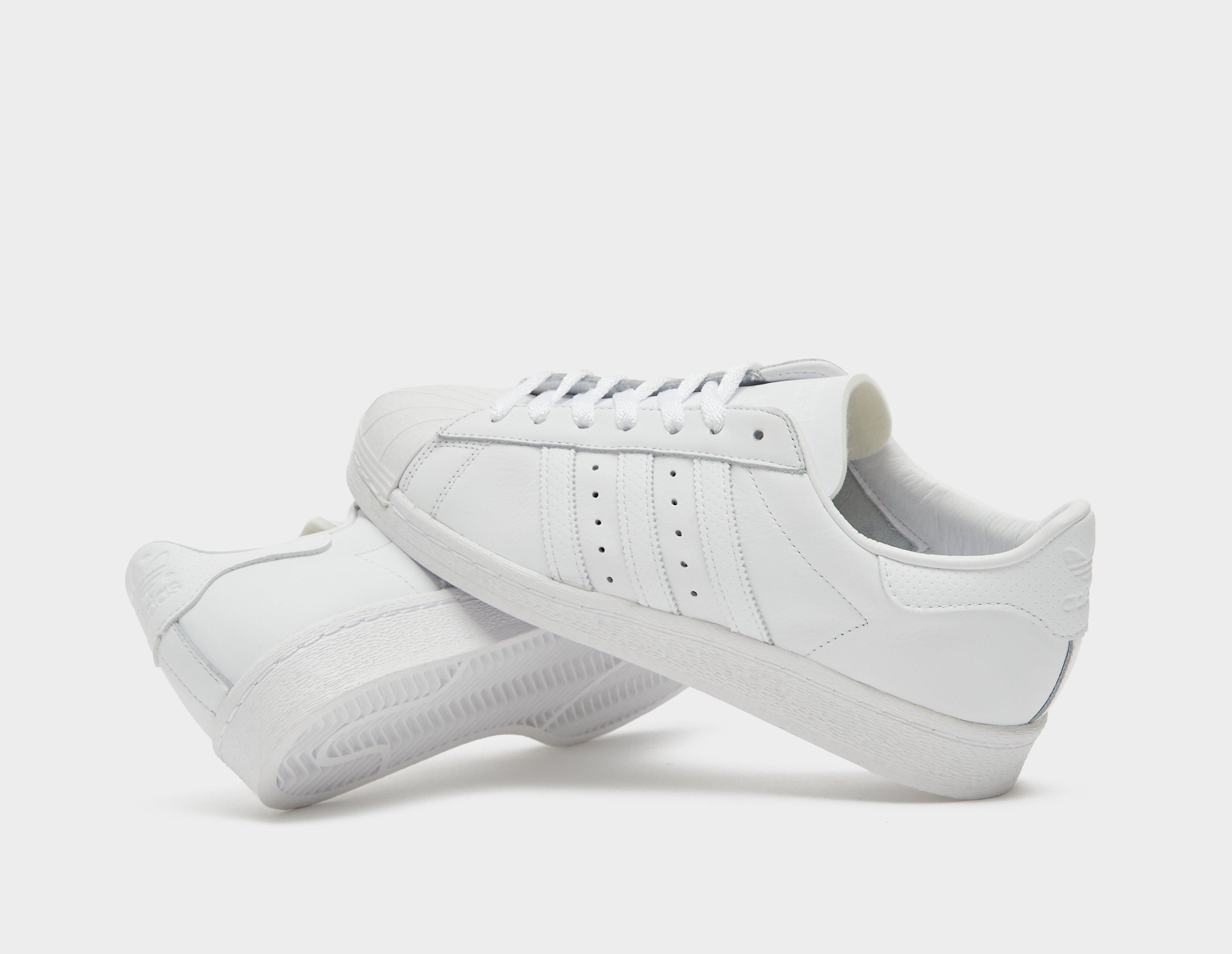 Solid best sale white adidas