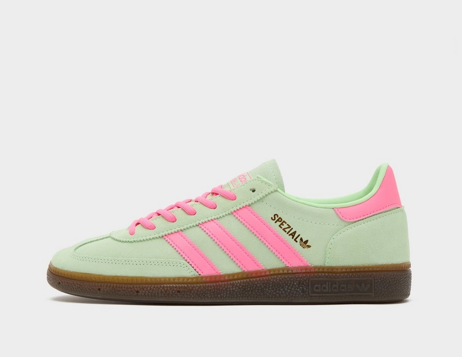 This is a sneaker in green, pink and with a dark gum sole.