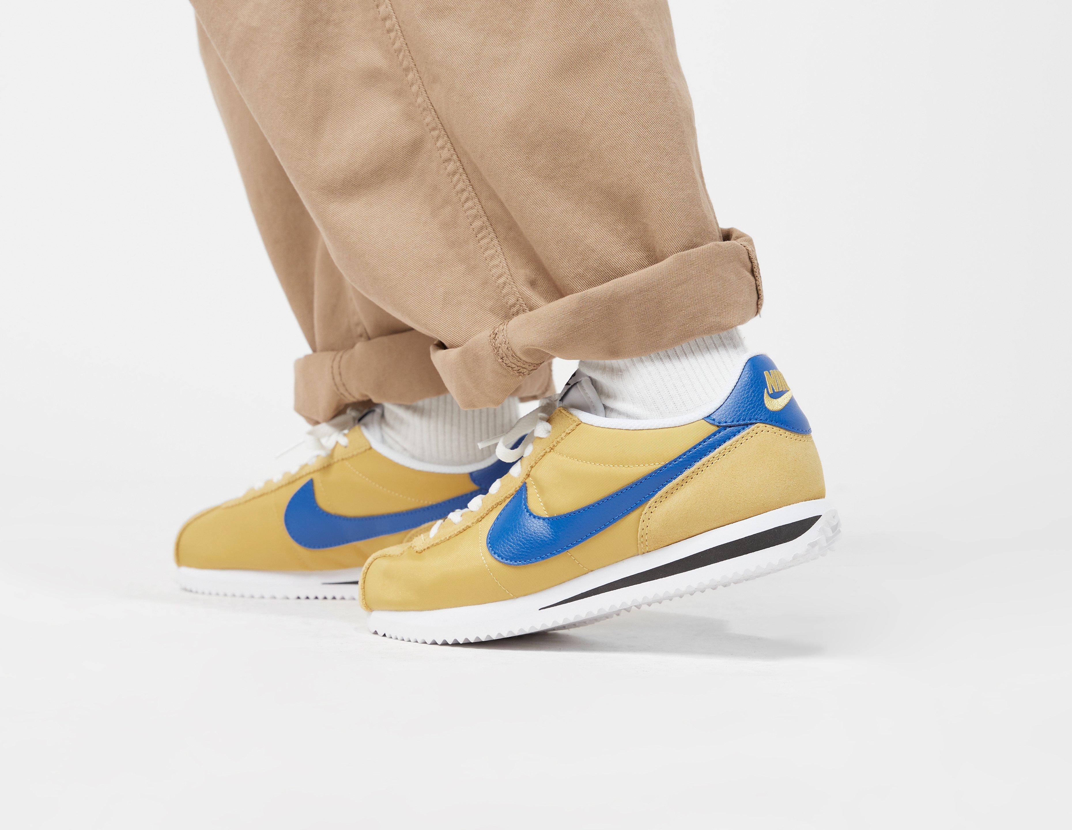 Nike cortez blue and yellow on sale