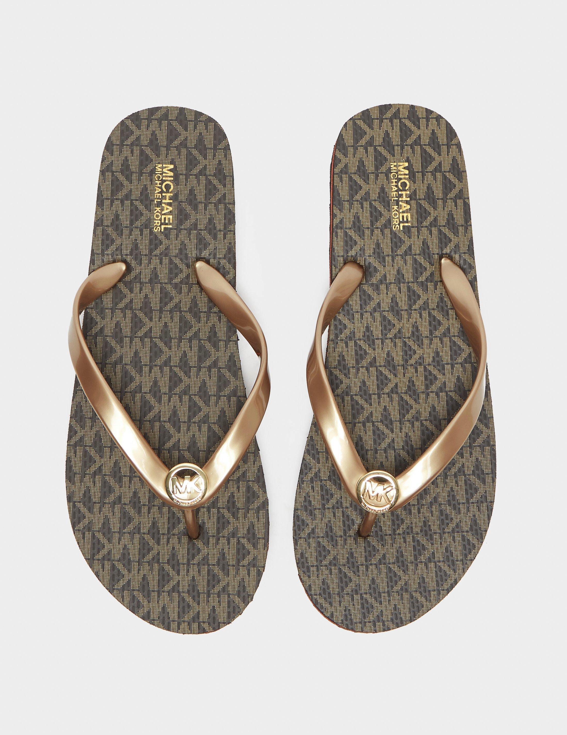 Brown Michael Kors Eva Flip Flops | Tessuti