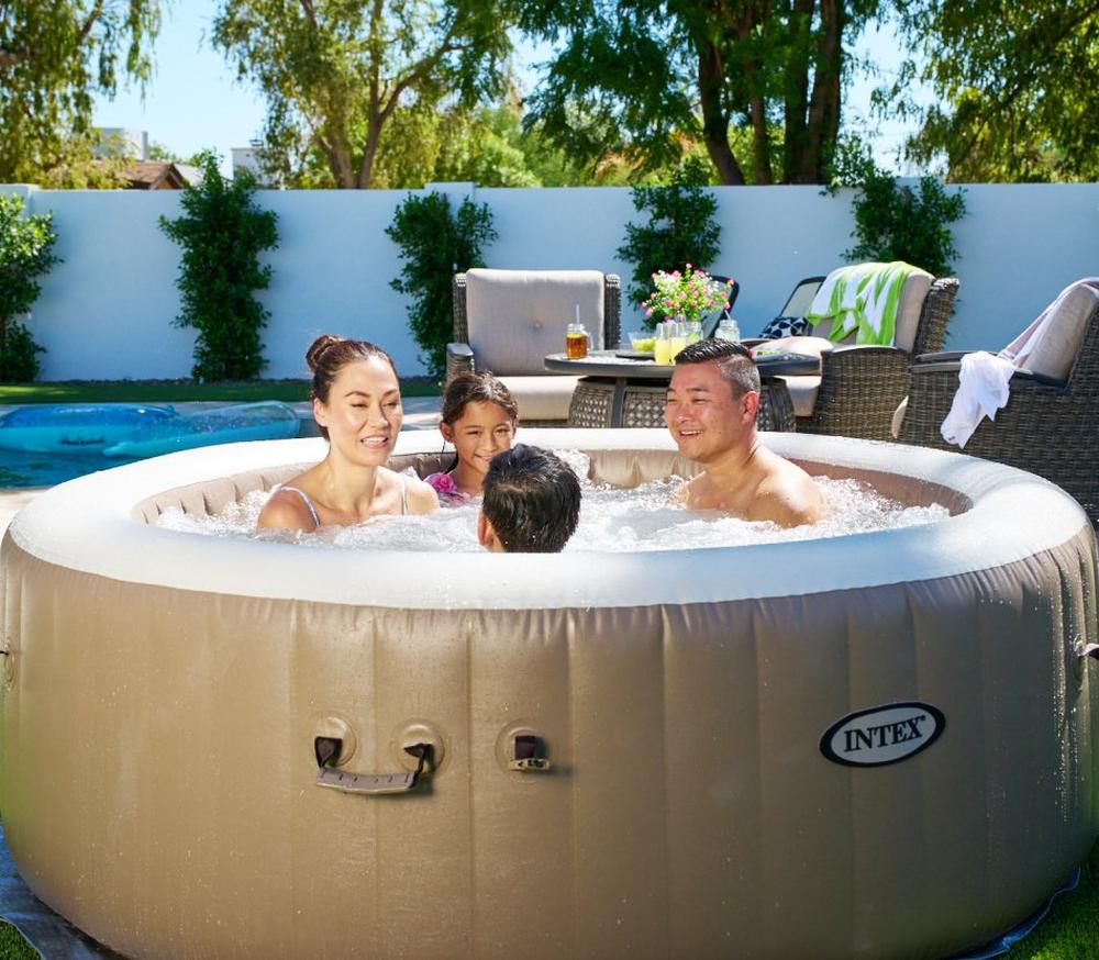 A picture of a family inside an inflatable hot tub