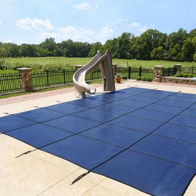 a swimming pool cover with a safety cover