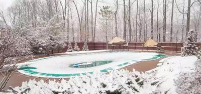 a cover swimming pool in the snow