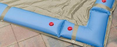 water bags holding down a winter cover