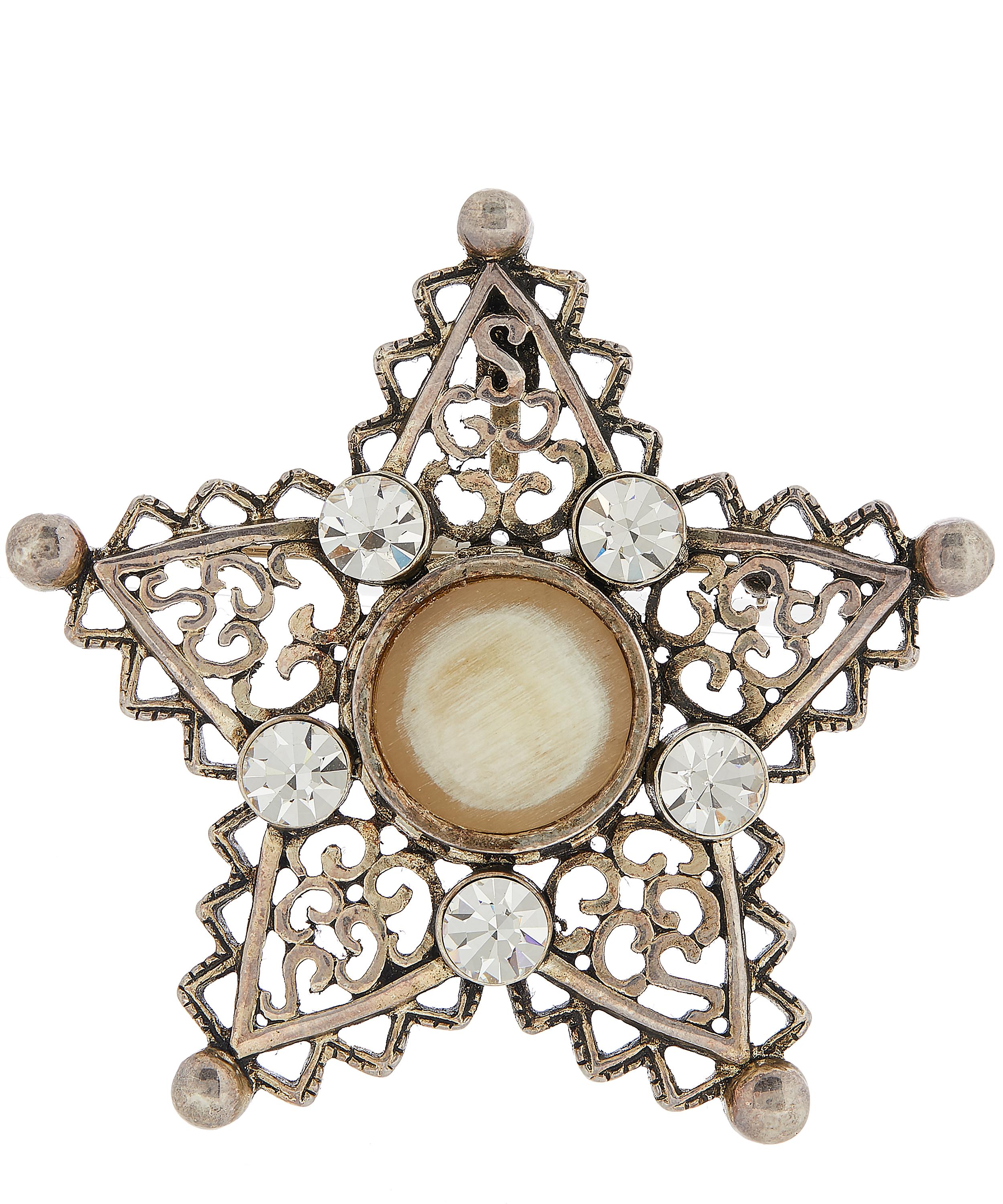 Designer Vintage - 1980s Christian Dior White Metal Horn and Faux Diamond Star Brooch image number 0