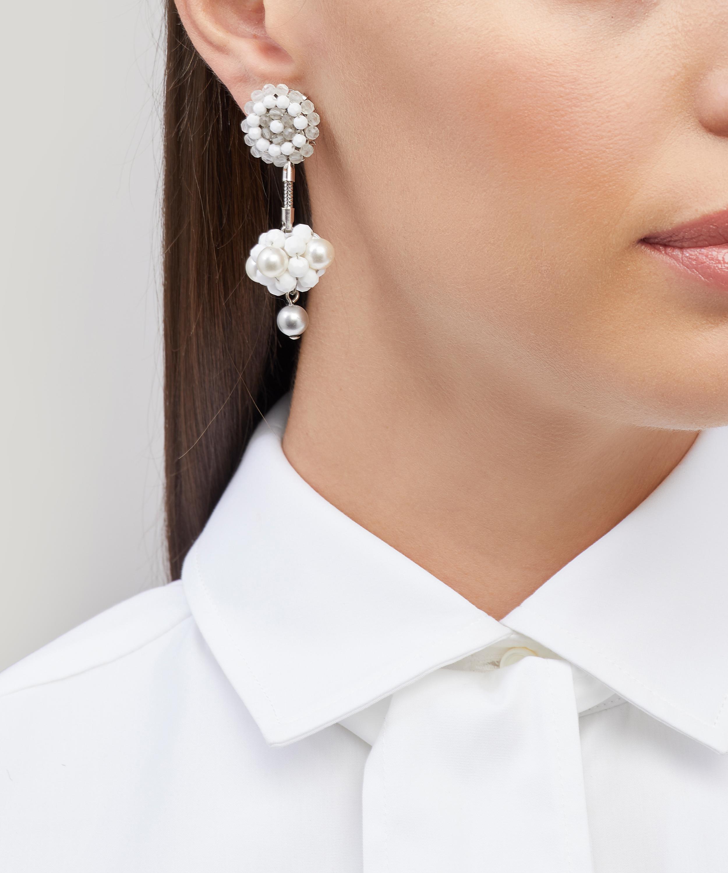 Designer Vintage - 1990s Daniel Swarovski White Metal Faux Gemstone Clip-On Drop Earrings image number 1