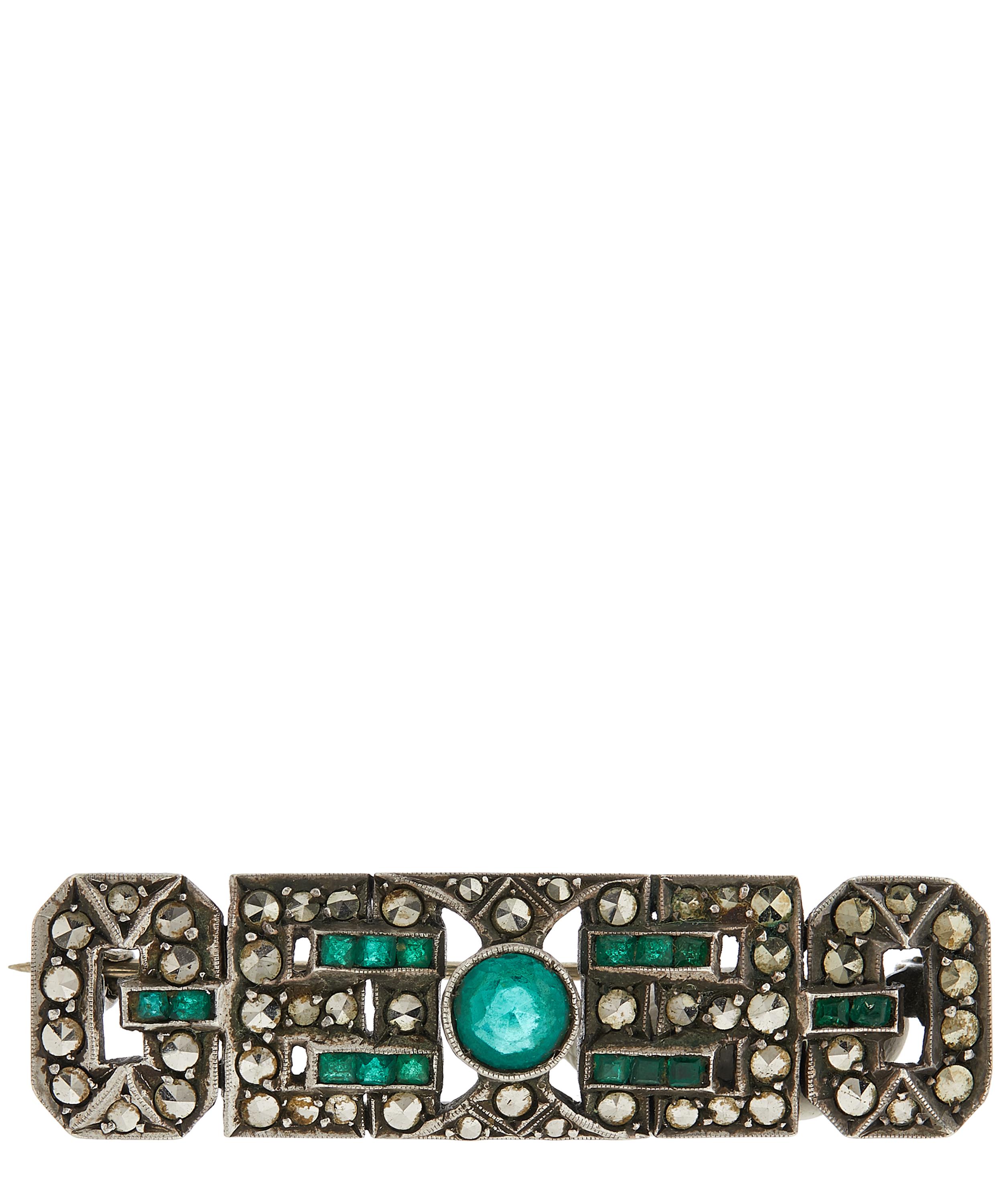 Designer Vintage - 1920s White Metal Marcasite and Faux Emerald Brooch image number 0
