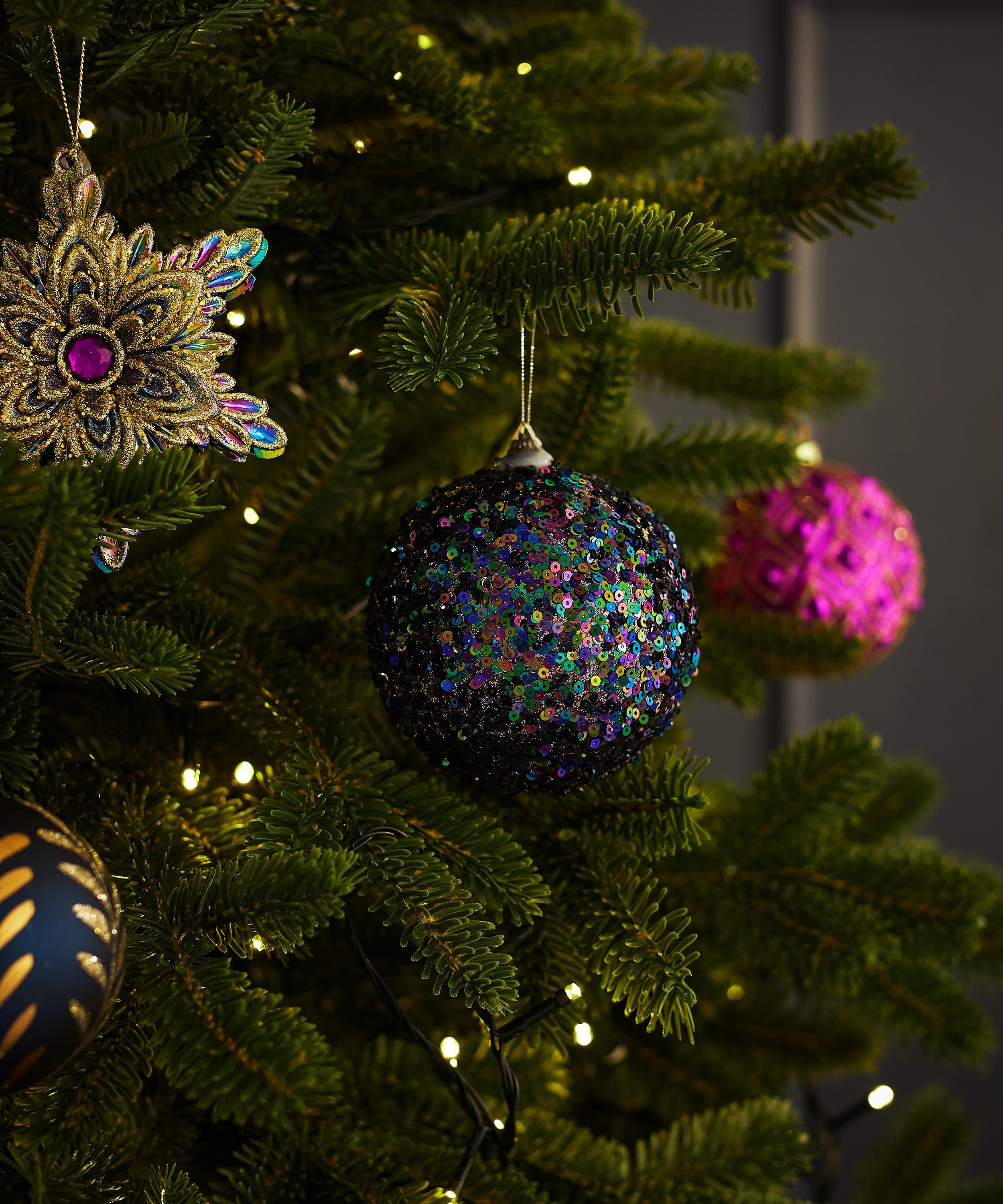 Peacock Ornaments Decorate Chandelier at Christmas - Debbee's Buzz