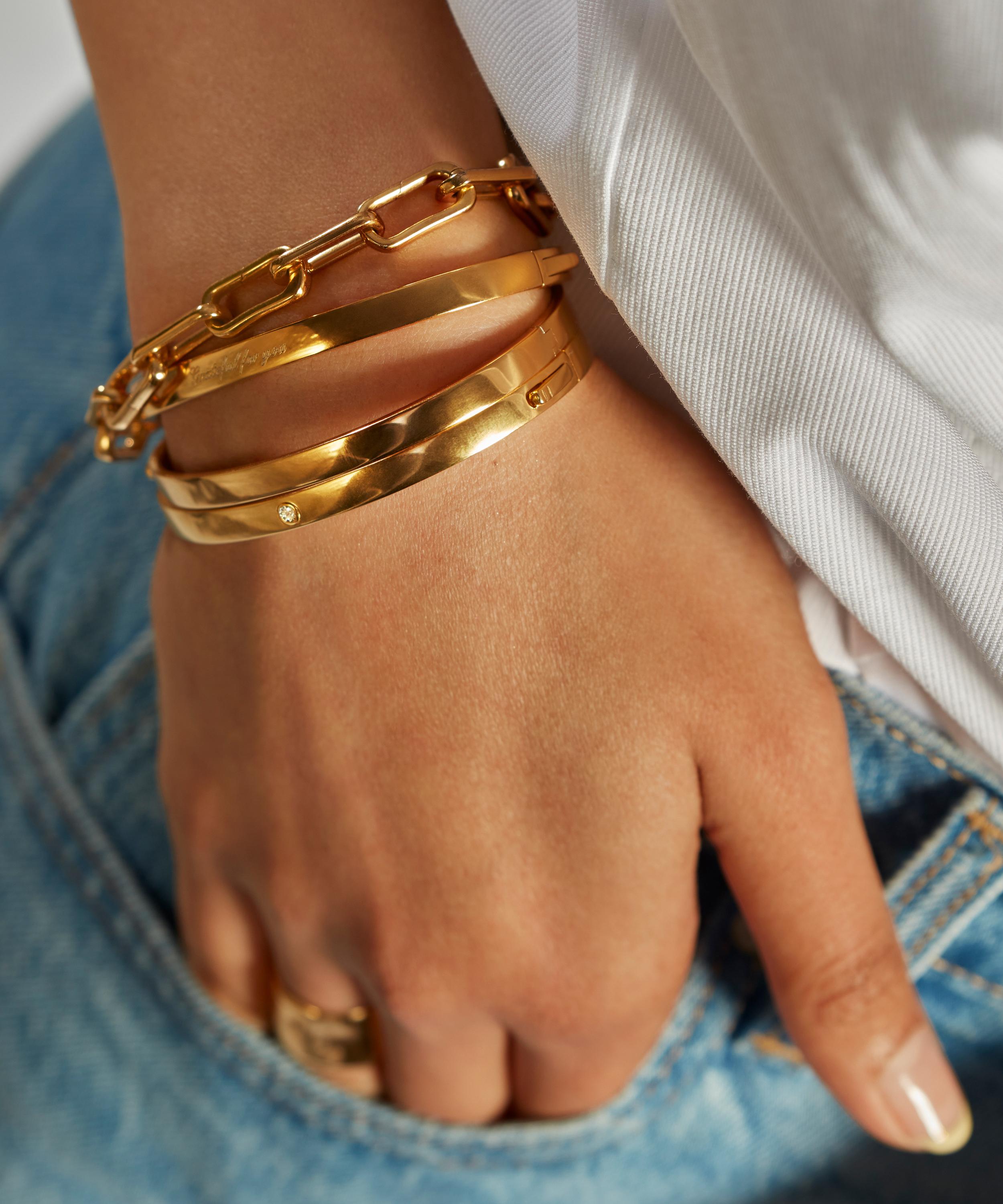 Gold bangle bracelet with shop clasp