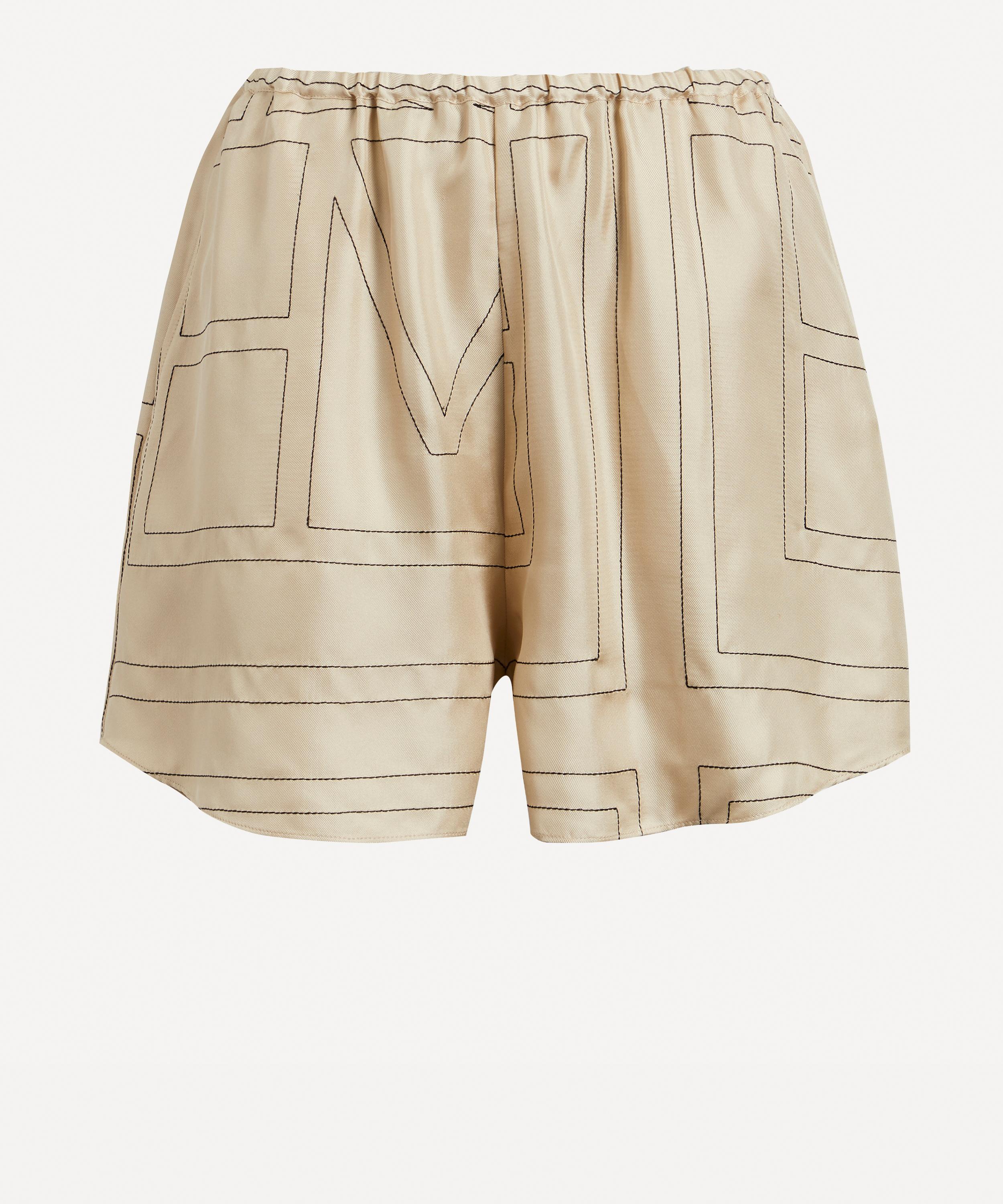 Monogram silk pajama shorts by Toteme