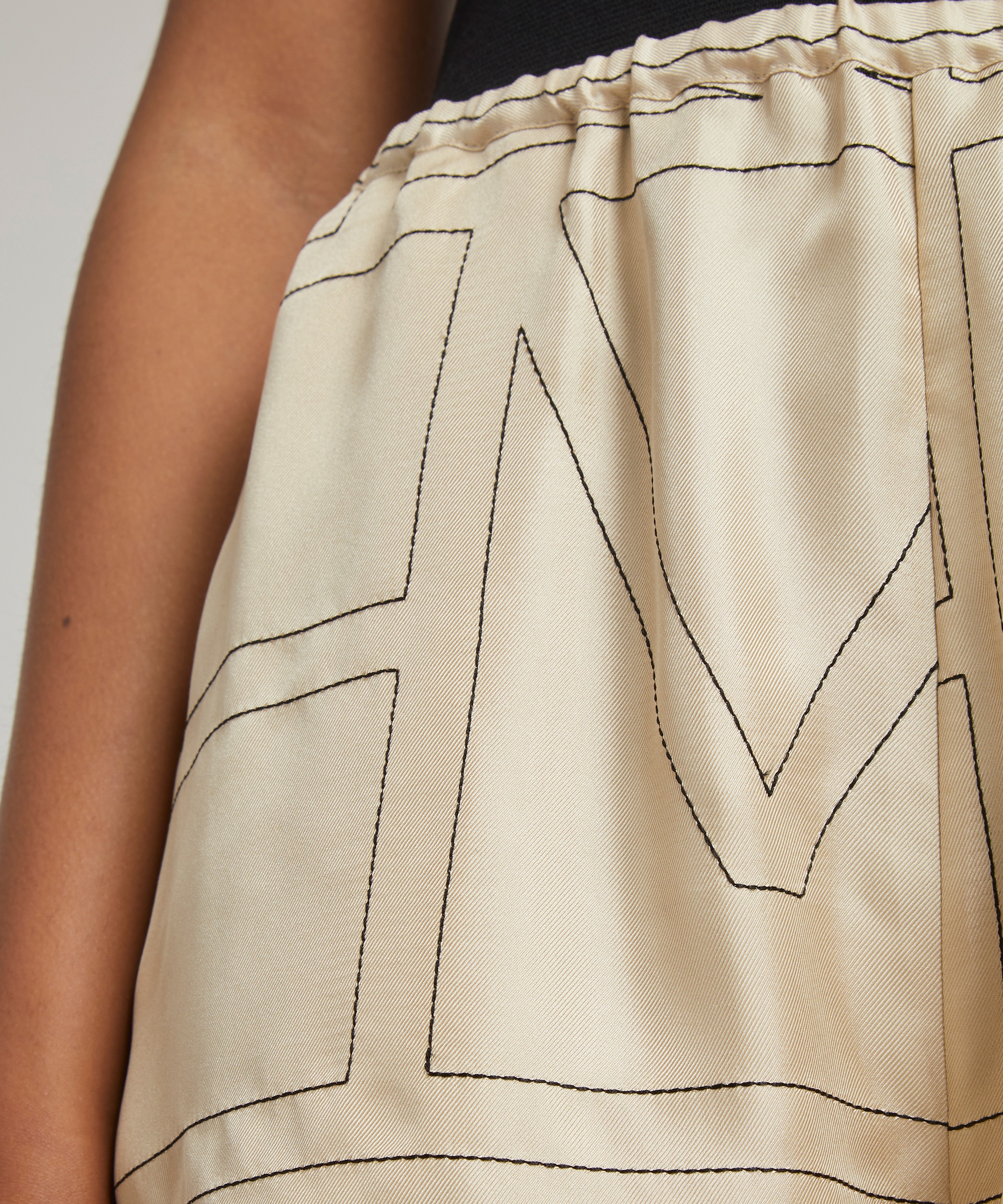 Monogram silk pajama shorts by Toteme