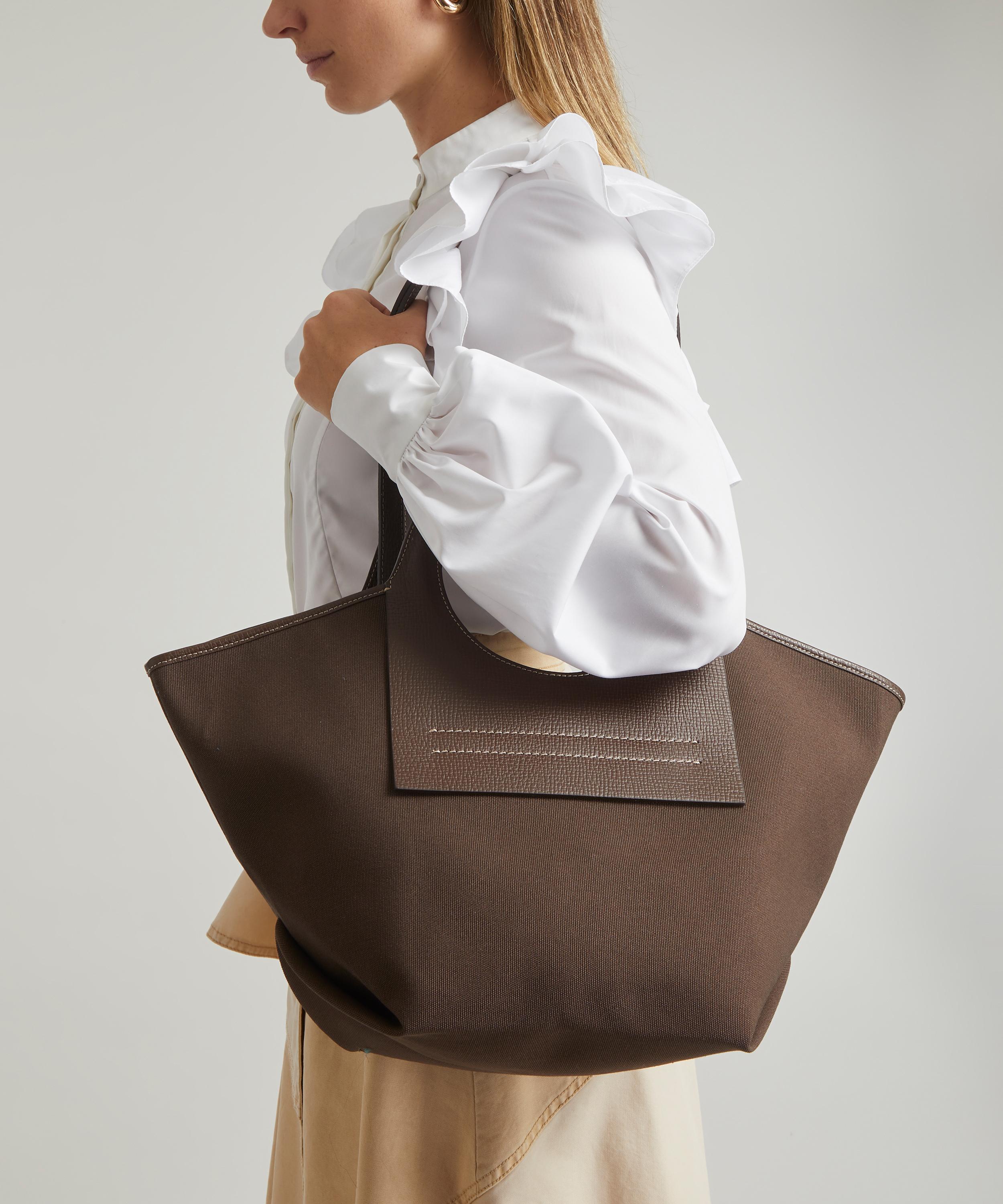 Cala small leather-trimmed canvas tote bag by Hereu