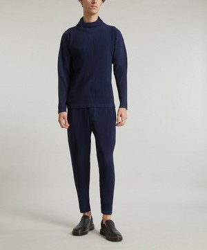 HOMME PLISSÉ ISSEY MIYAKE - MC December Pleated Tapered-Trousers image number 1