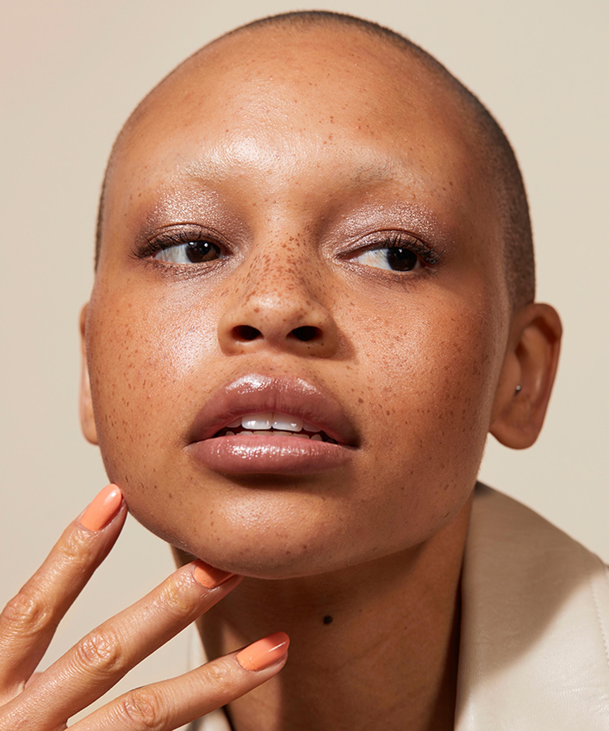 Model with Jones Road Miracle Balm