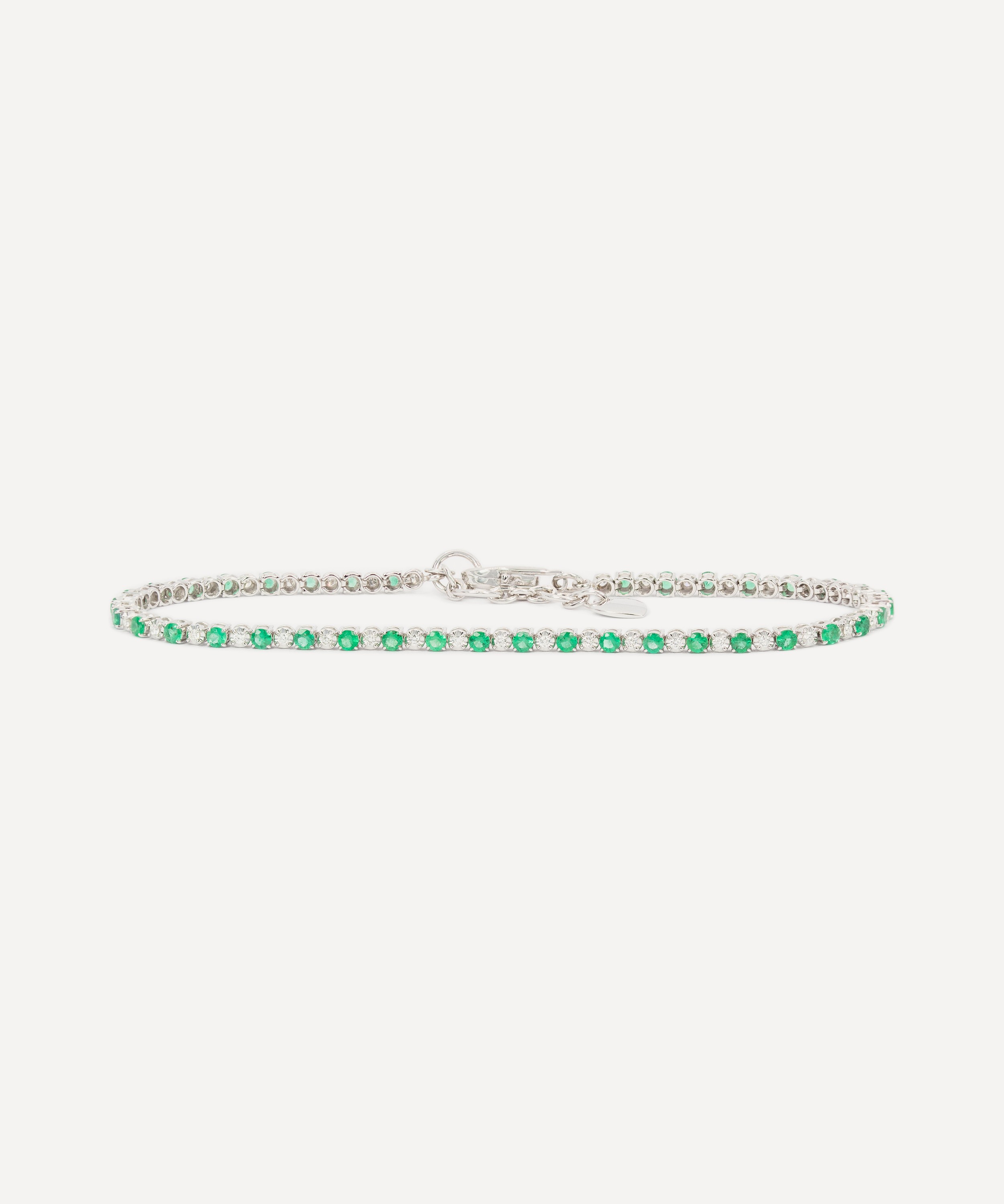 Kojis - 18ct White Gold Emerald and Diamond Tennis Bracelet