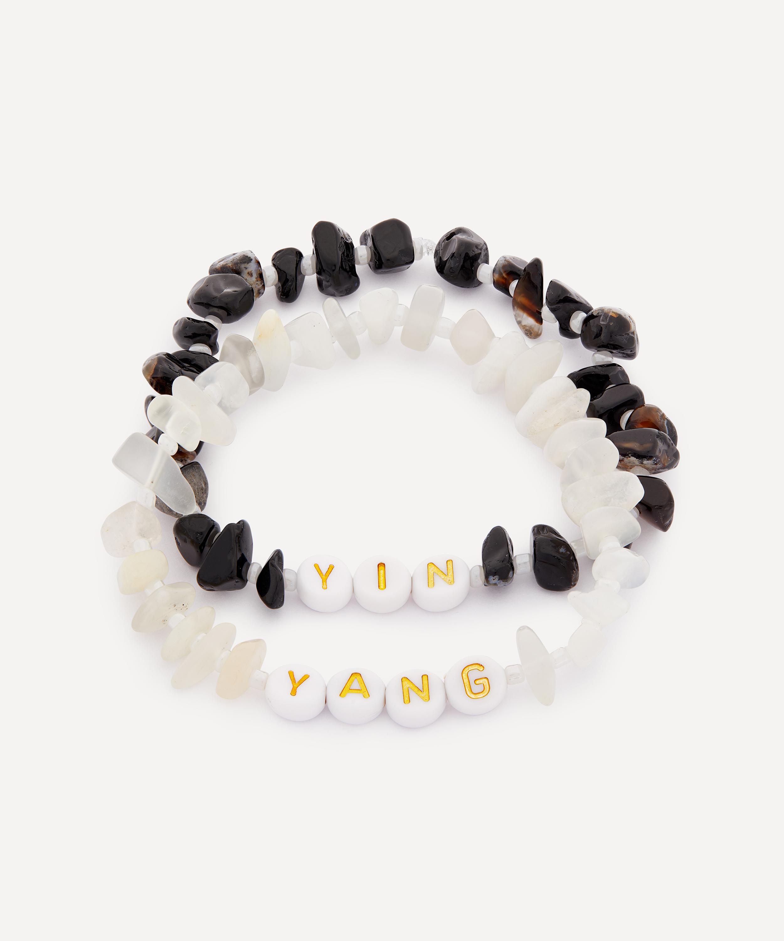 GIfts for sisters, best friends. Gemstone bracelet set Includes two bracelets Moonstone crystals Black onyx crystals Gold-tone enamel letter beads spelling out “Yin Yang” Slip on fastening. 