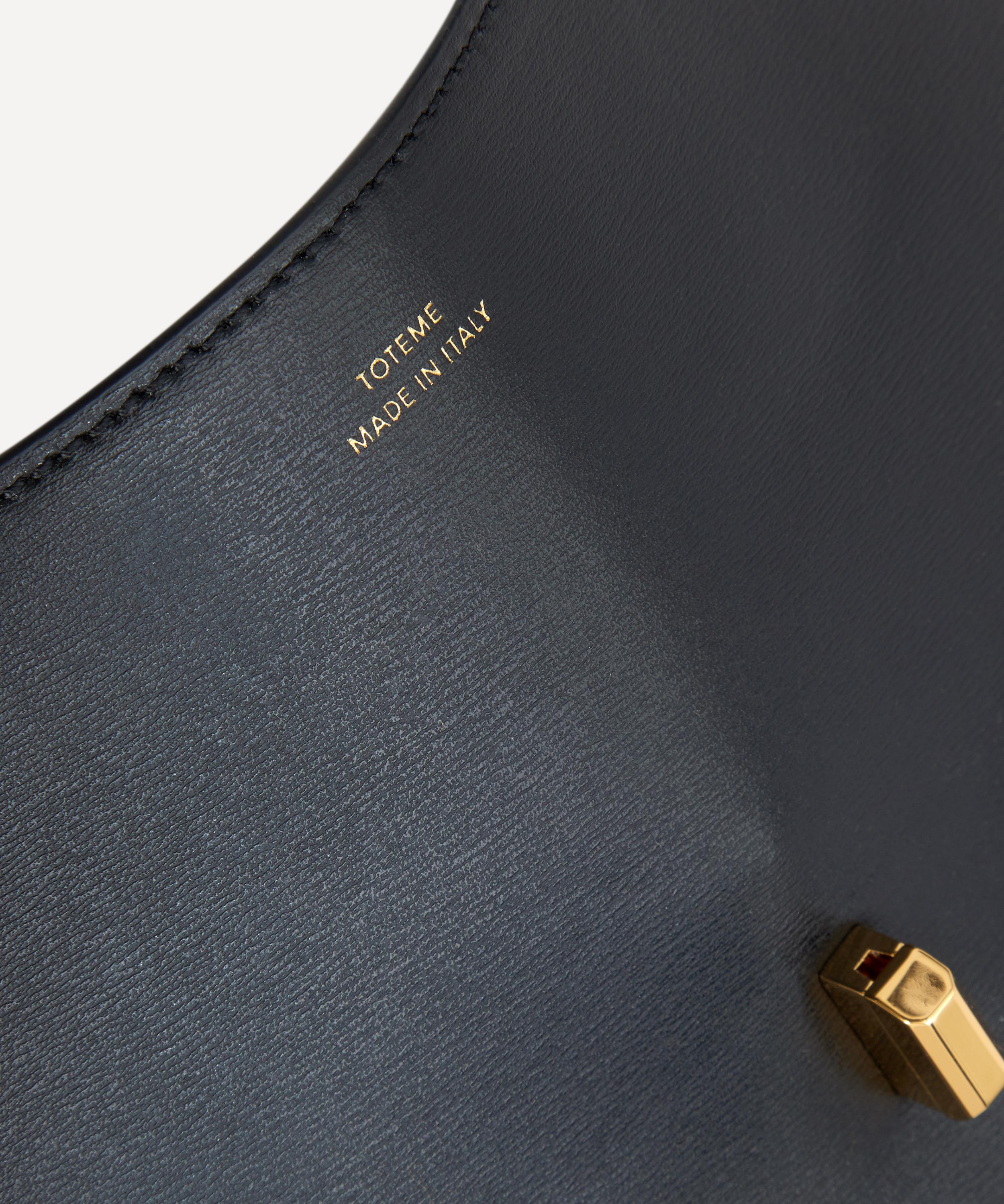Toteme T-Lock Clutch Bag with Strap | Liberty