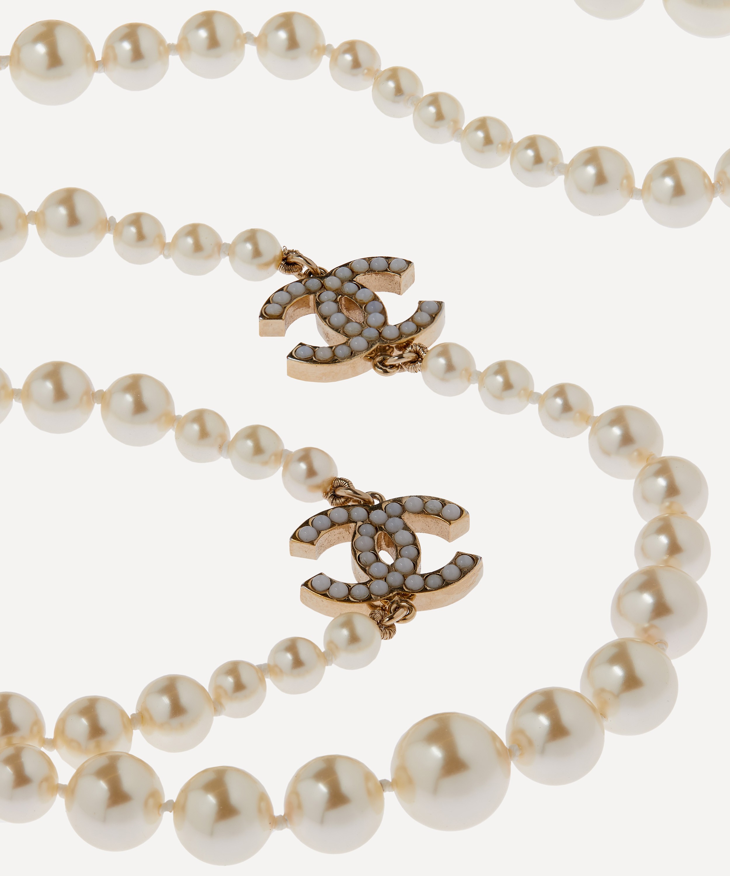 Chanel Faux Pearl and Crystal Silver CC Pendant Necklace – Madison Avenue  Couture